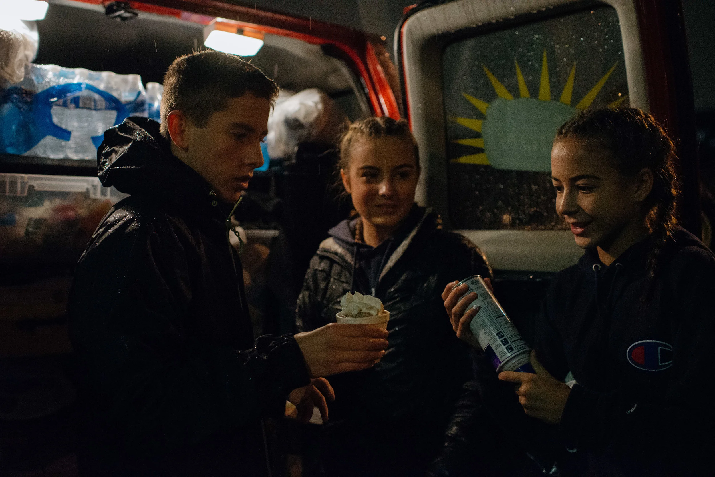 Izzy, Kennedy and their friend, Connor, serving hot chocolate to homeless neighbors.