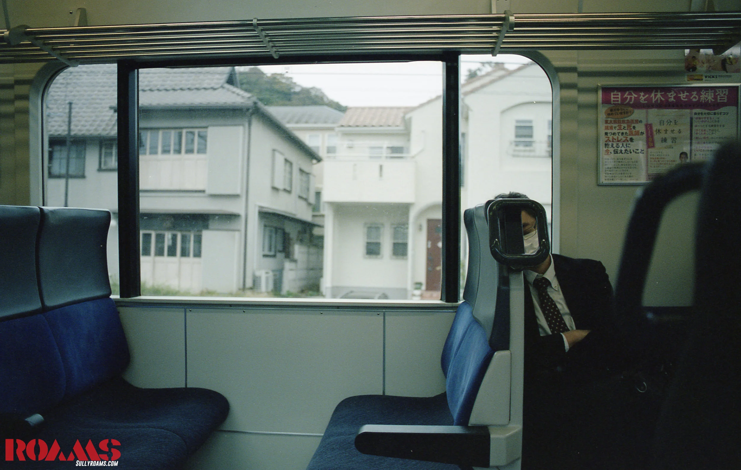 24 on train to kamakura looking at salaryman.jpg
