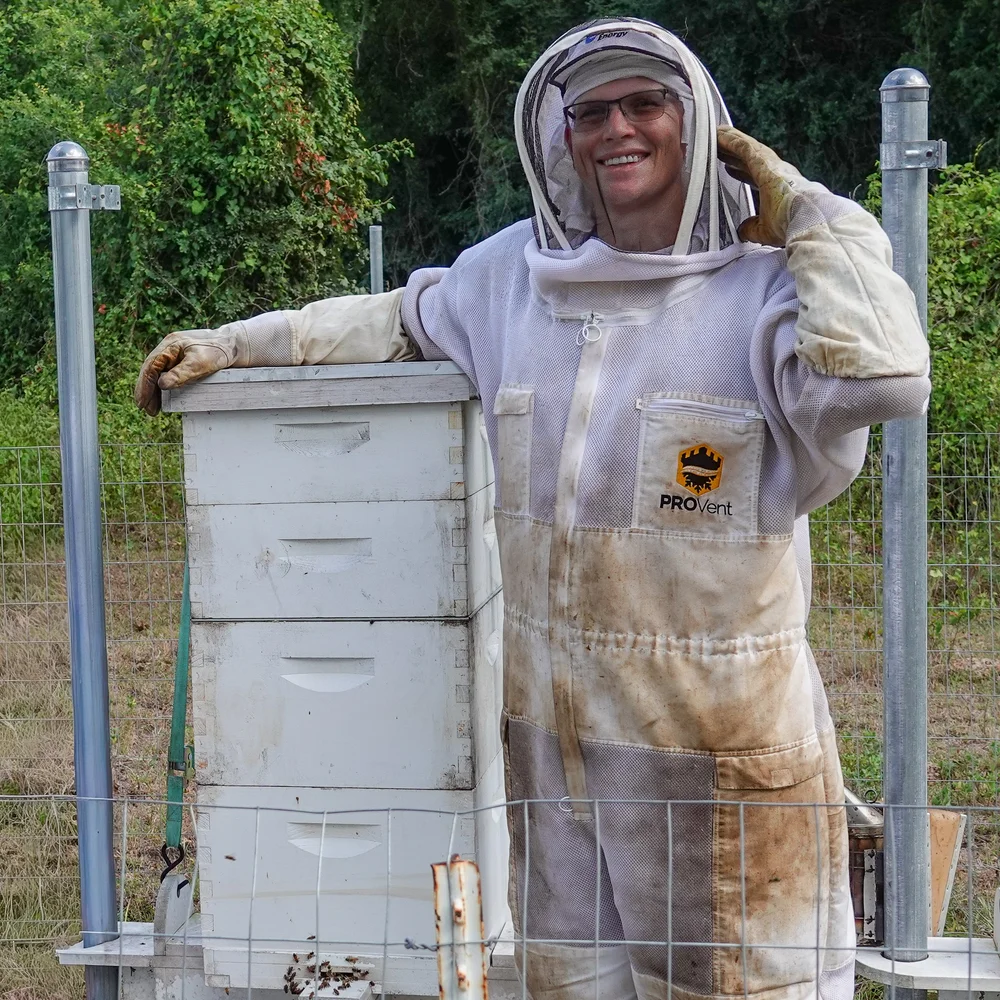 Beekeeper beside ArkHive in the field
