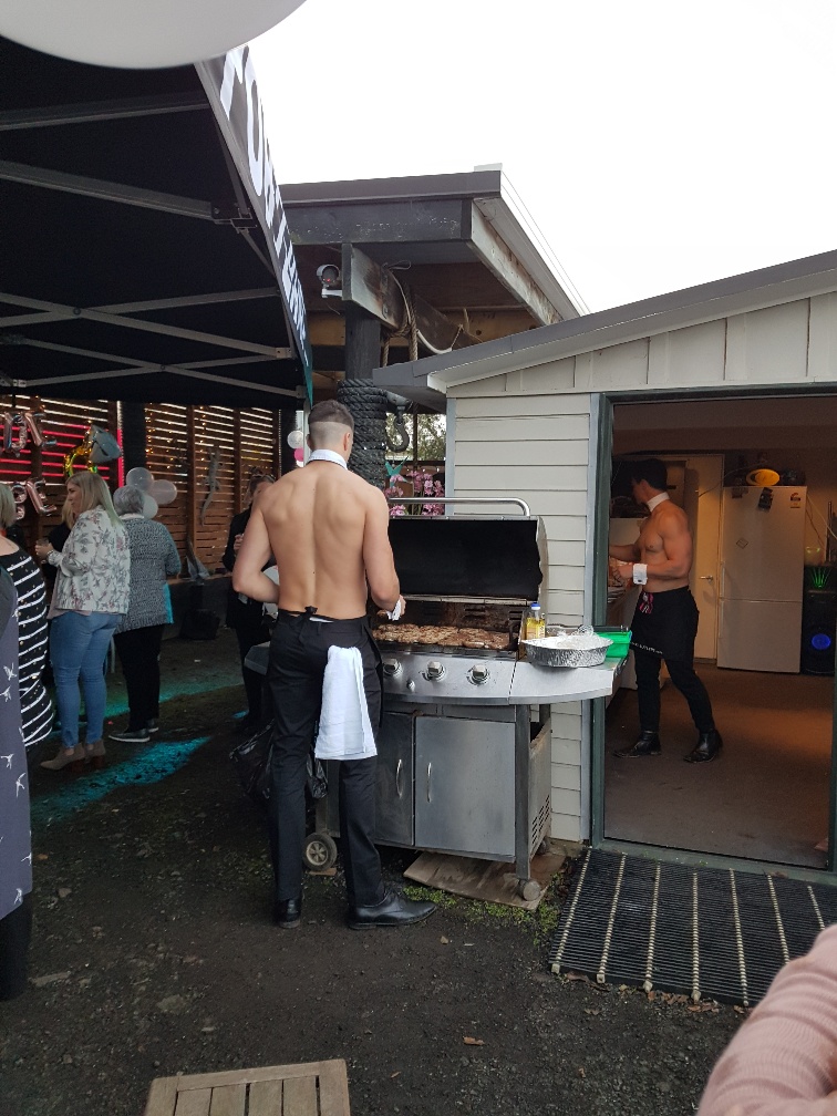 Topless waiters cook the BBQ and mix cocktails with Bare Butlers
