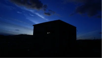 At Home , At War 2018 Video still from performance (outside the building )