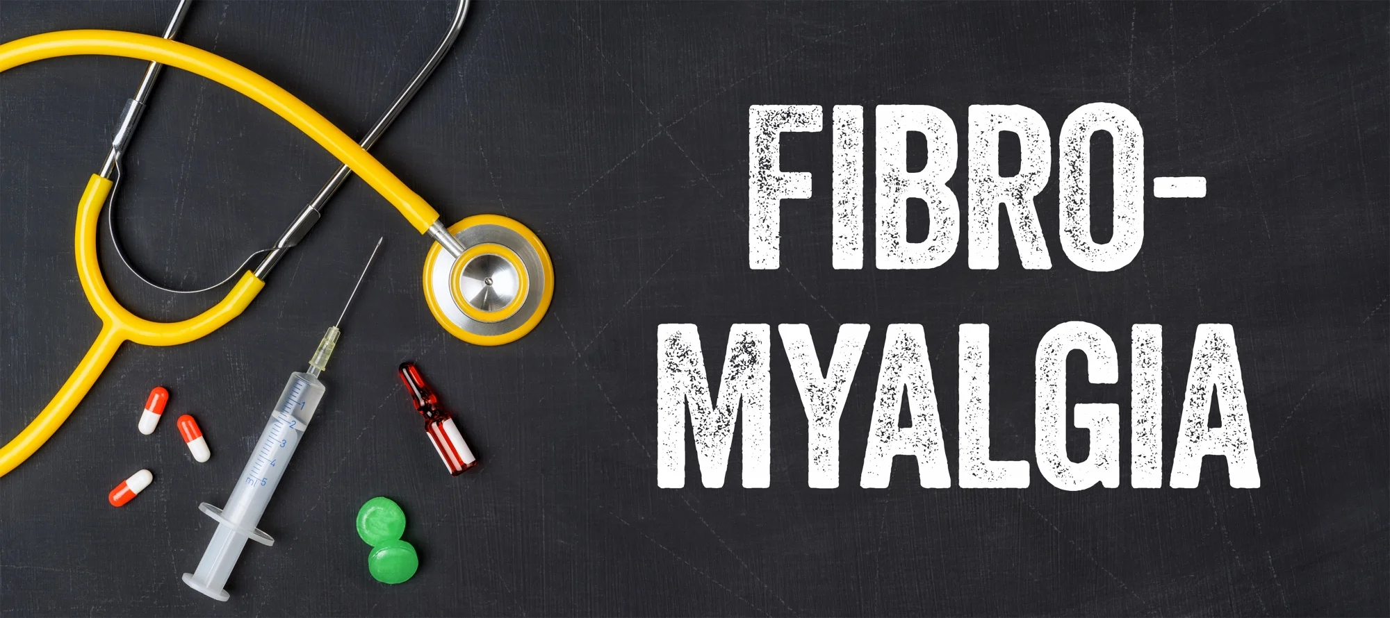 Stethoscope and pharmaceuticals on a blackboard - Fibromyalgia.jpg