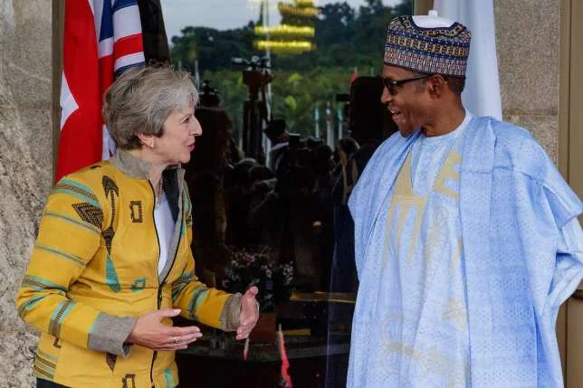 British Prime Minister Theresa May wears Emmy Kasbit on official visit
