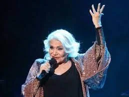 Famous Greek singer Marinella suffers a stroke while performing on stage.