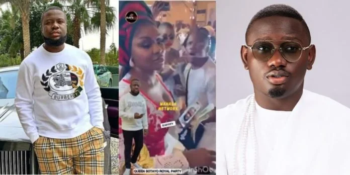 Hushpuppi Sprays Money on Singer Segun Johnson from Jail in New Video
