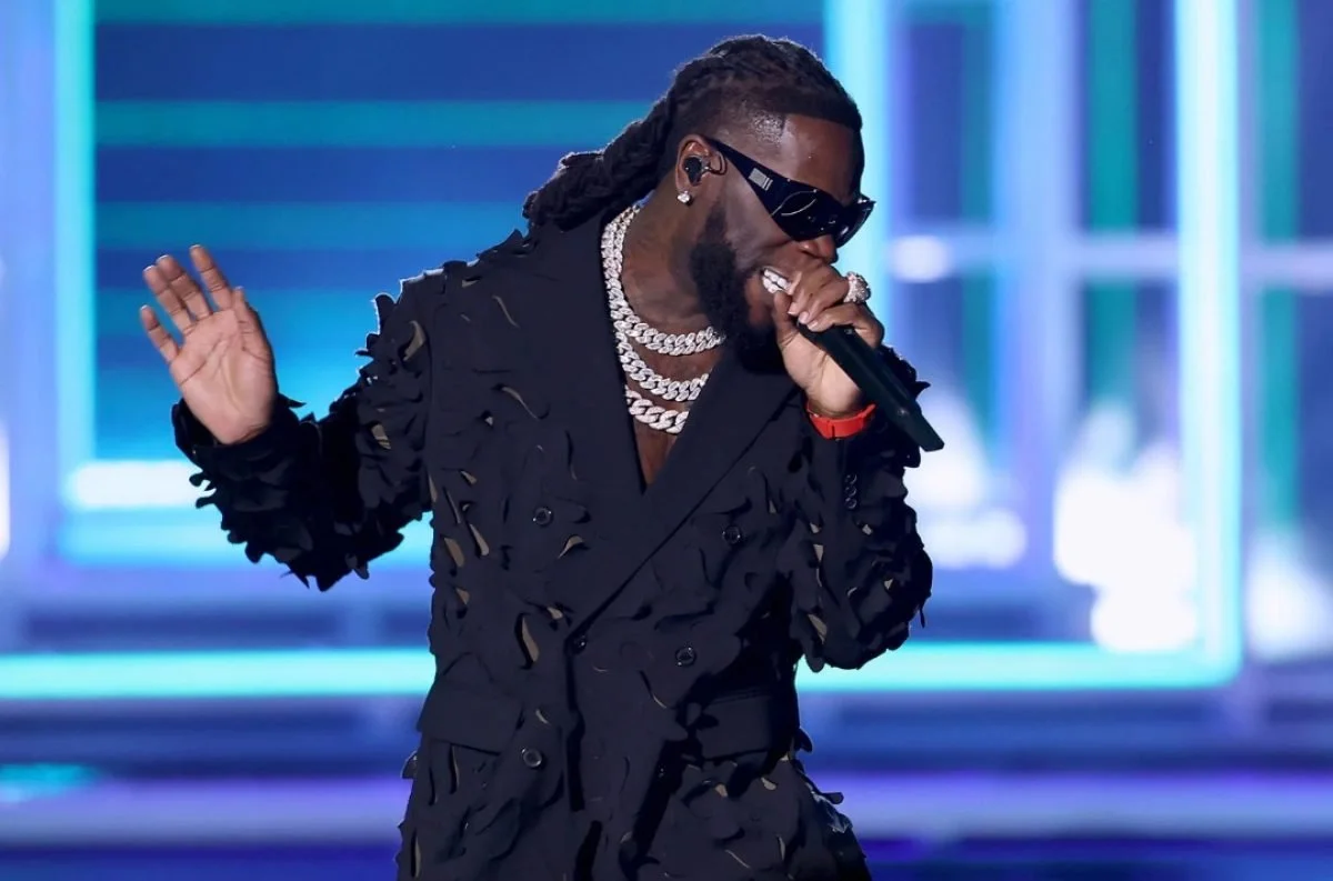 Burna Boy Falls Ill While on Tour, Video of Singer on Drip Sparks Worry Among Fans