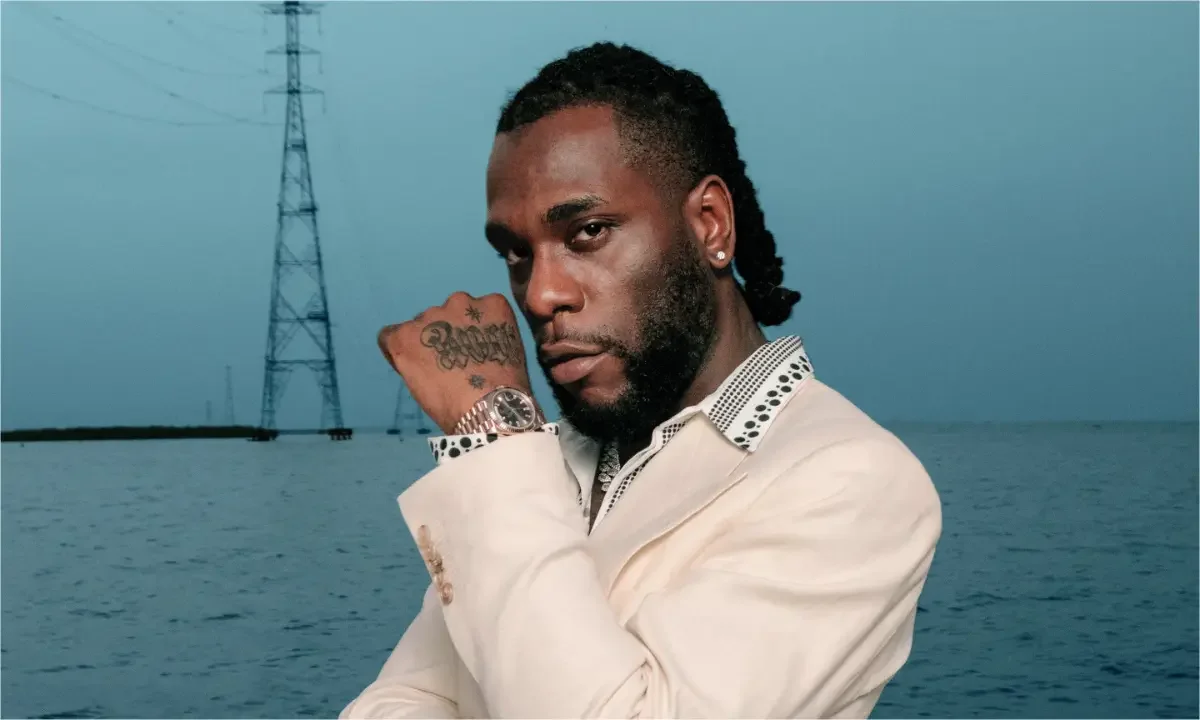 Burna Boy Snubs Messi and Ronaldo, Names Jay Jay Okocha as Football GOAT