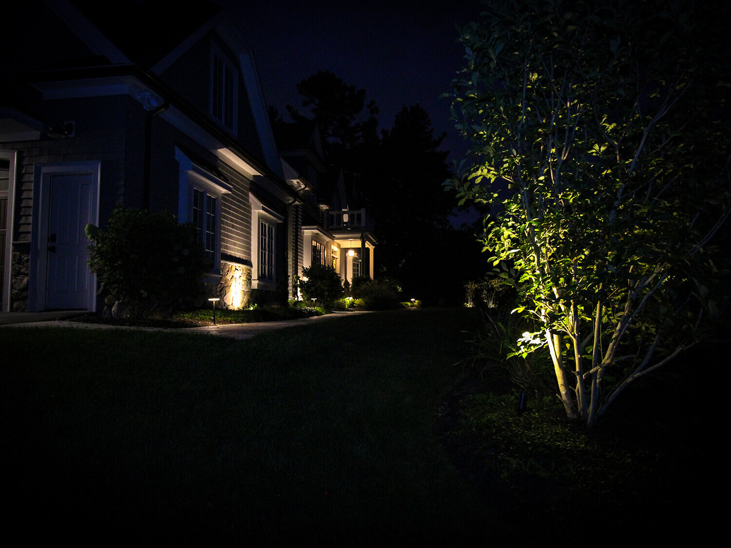 Beautiful House with Landscape Lighting at night
