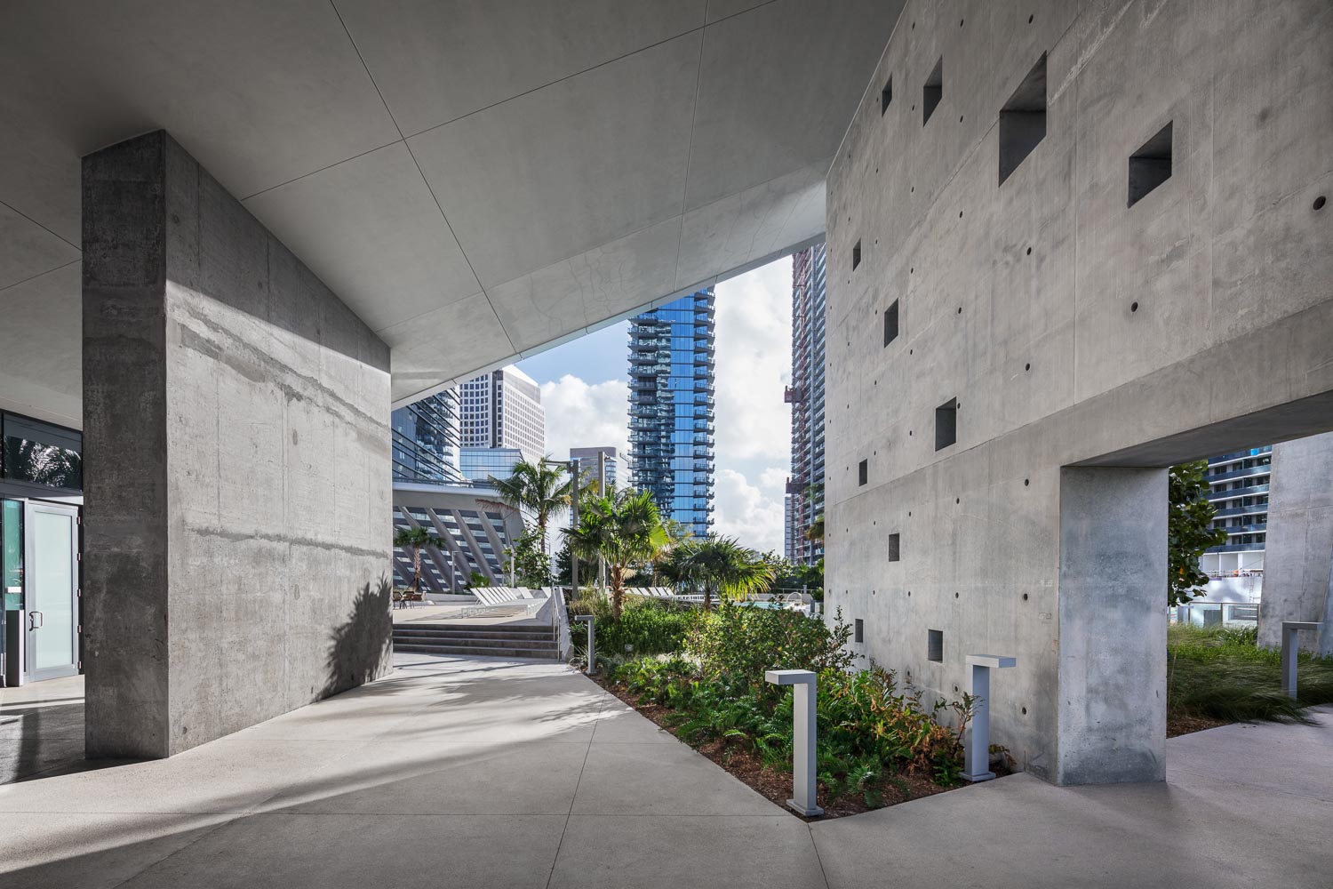 At RISE, imposing architecture leads you to the rooftop pool deck located in between skyscrapers