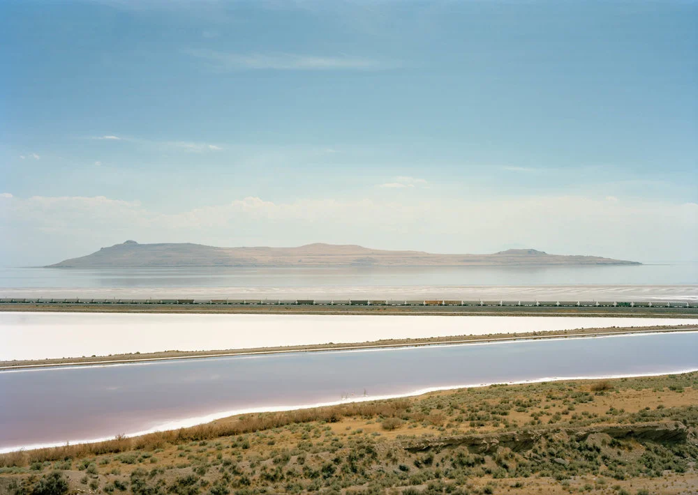 Image © Untitled, ( Train crossing Great Salt Lake, UT ), 2016. (Click to see full image). Courtesy of Victoria Samburanis
