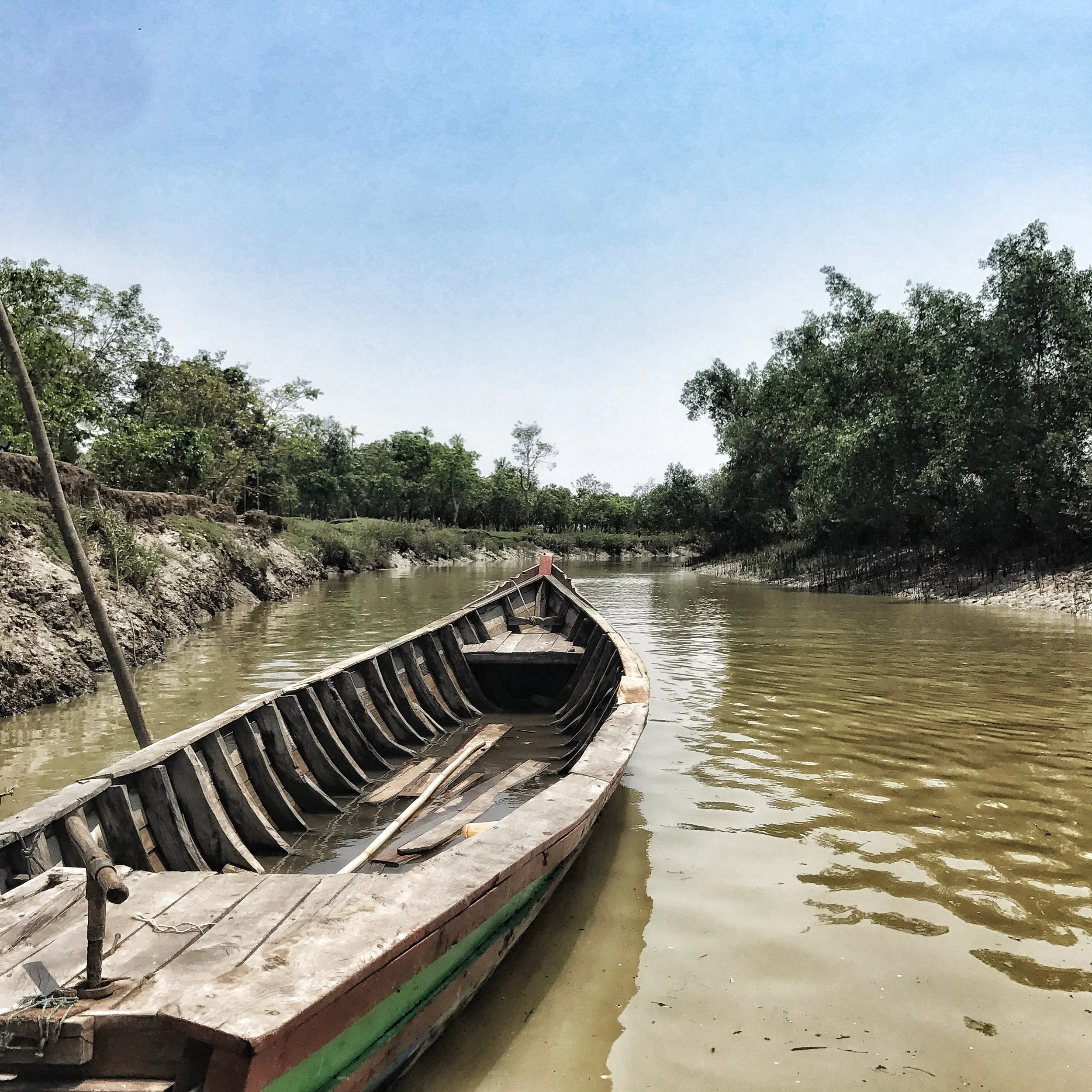 An empty boat on the riverways of seemingly-peaceful Northern Rakhine State, Myanmar, just days before the Rohingya Crisis erupted there. Photo by Ashley S. Kinseth.