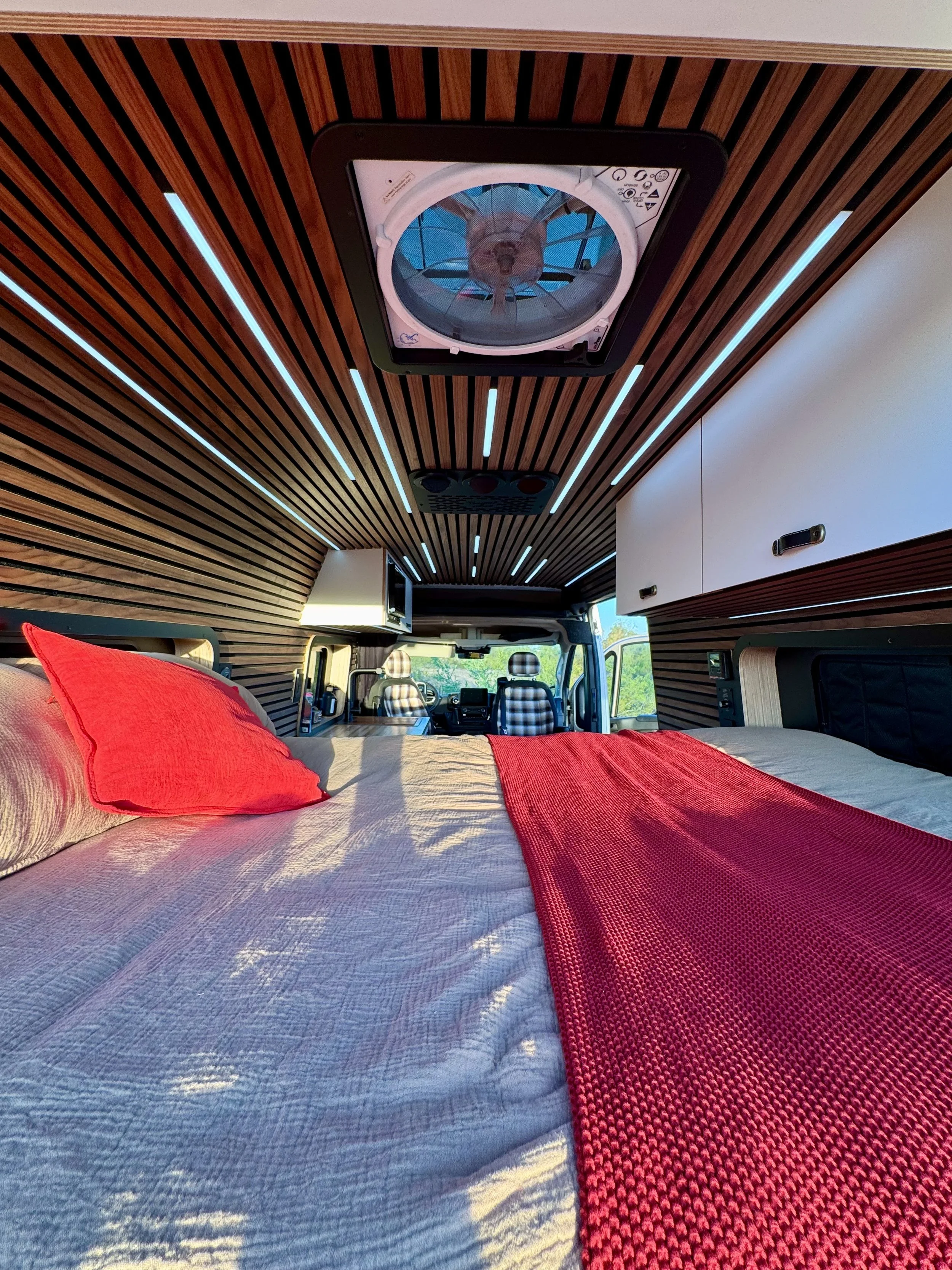 guthrie-boho-camper-van-rental-bed-area.jpeg