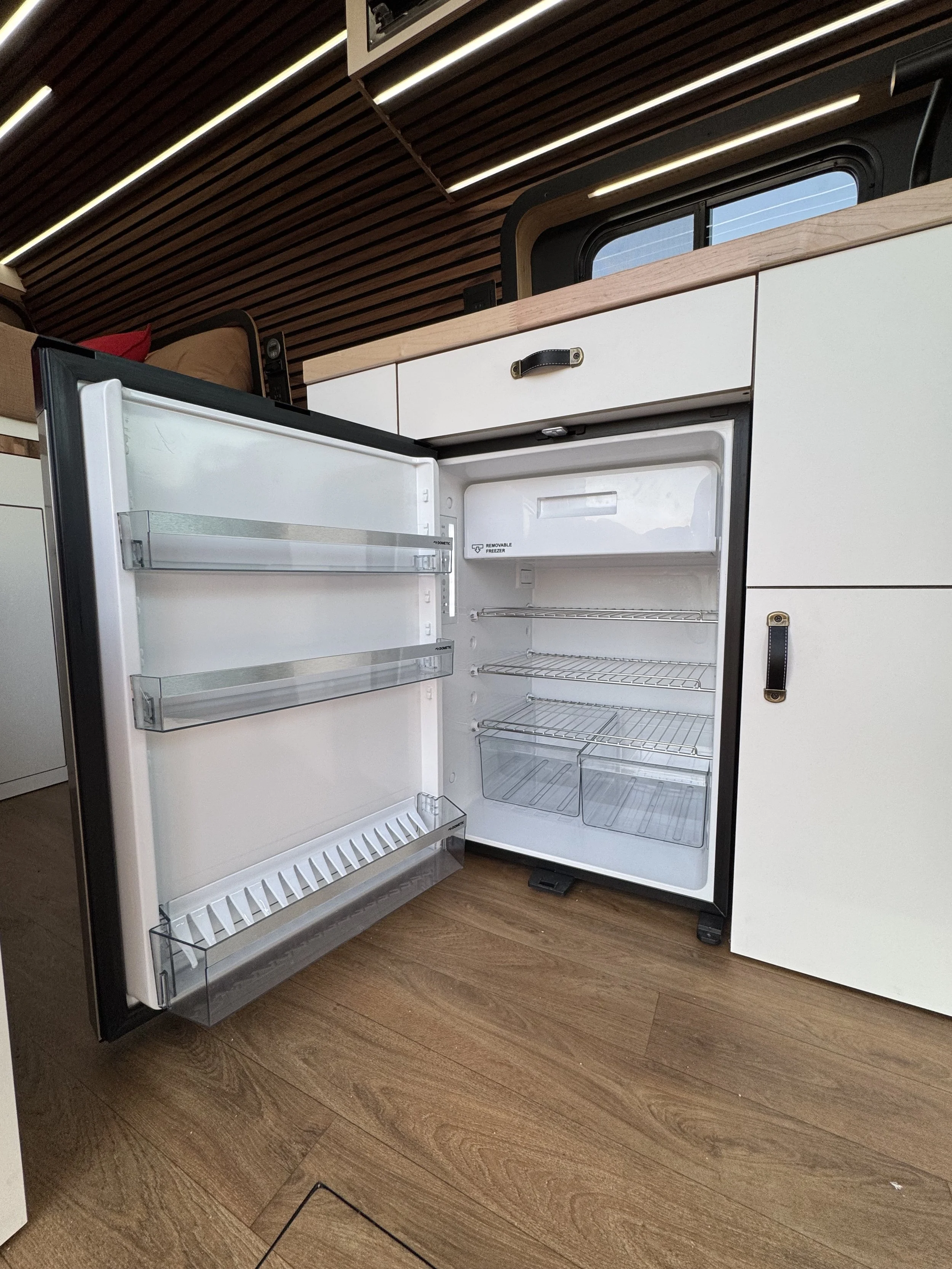 guthrie-boho-camper-van-rental-refrigerator-freezer.jpeg