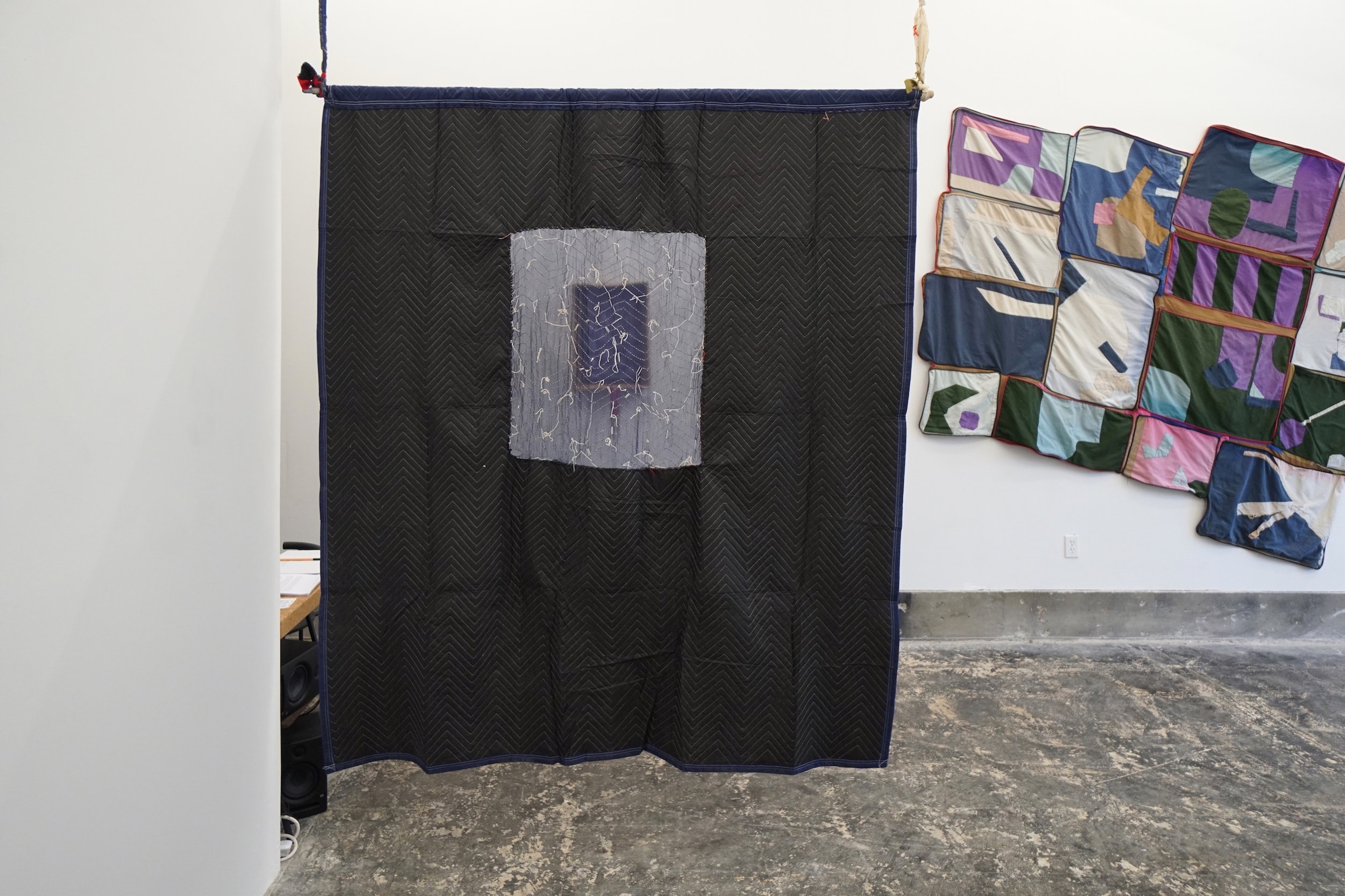  Morgan Ritter  The sea is dimensional yet without surfaces (with Walking Ropes) , 2018 Moving blanket, silk, alpaca, and acrylic thread, broomstick 82 x 71 inches 