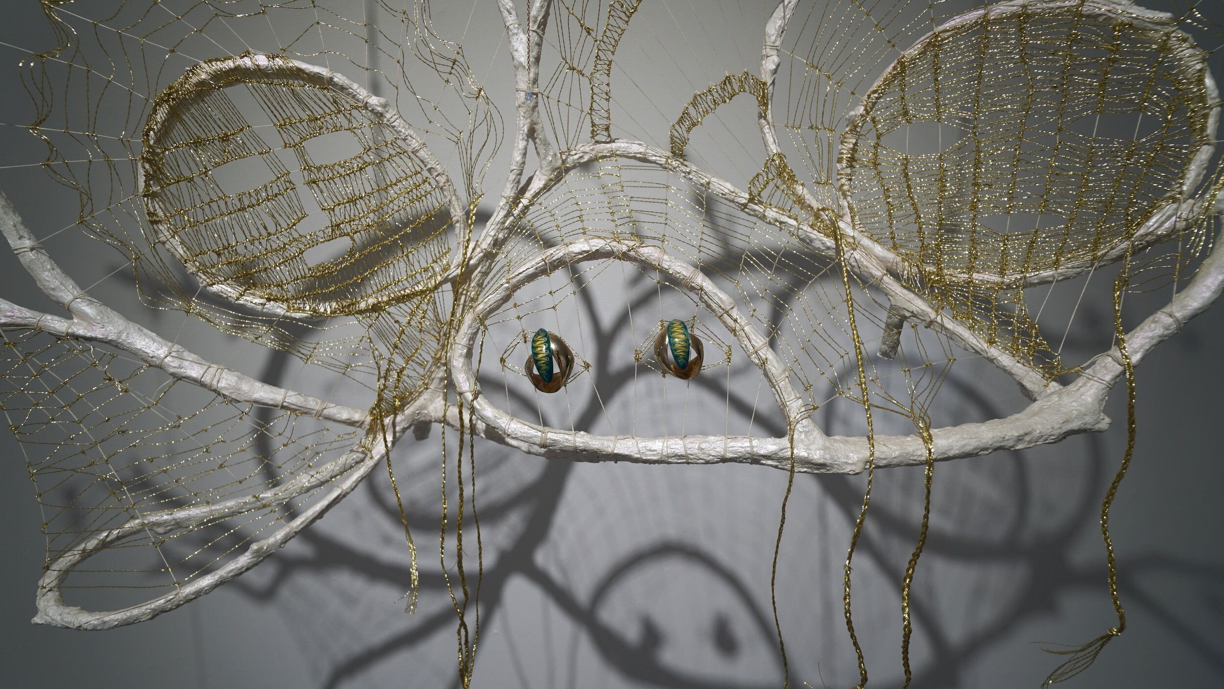  Mindy Rose Schwartz - Detail view    Glance Back , 2020 Branches, reeds, wire, resin, linen cord, lamé cord, earrings, crystals, fake flowers, chain 50 x 51 x 13 in 127 x 129.5 x 33 cm 