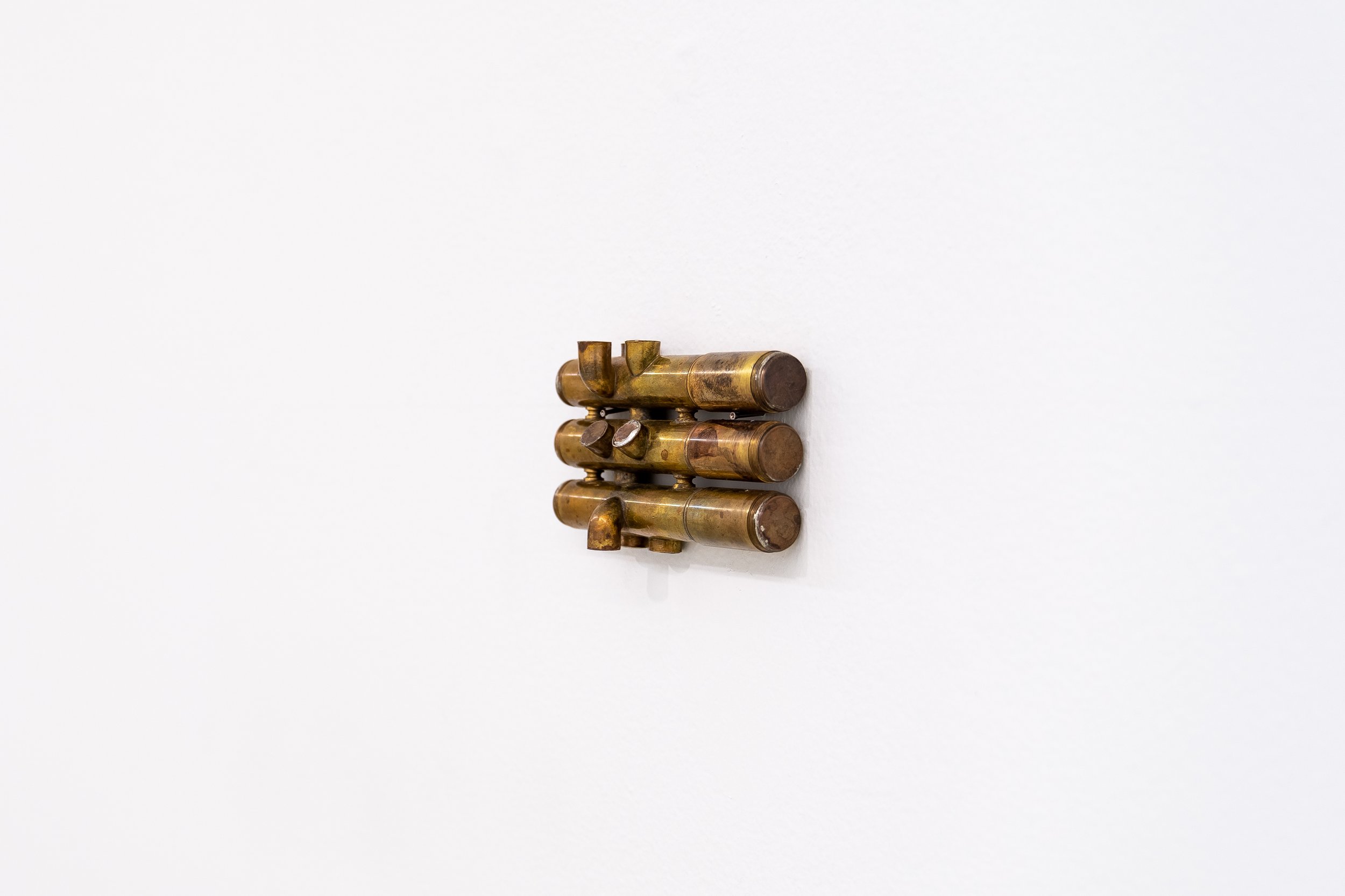  Gozié Ojini  Borrowed Breath , 2023 Altered brass instrument, copper pennies, tin solder 