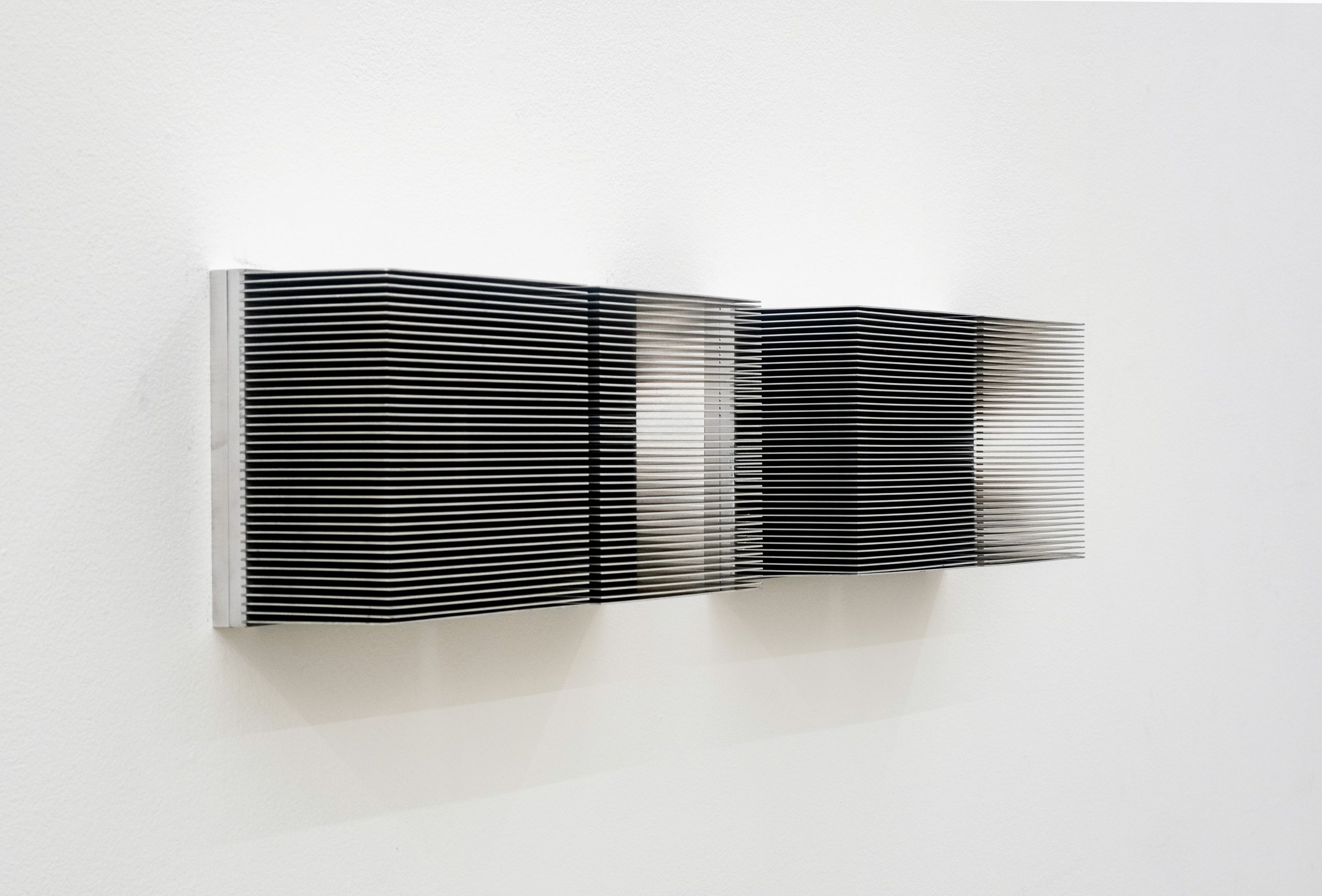  Anthony Discenza  Wall Piece,  2024 Pair of salvaged aluminum heatsinks Each 8 x 16 x 5 inches 