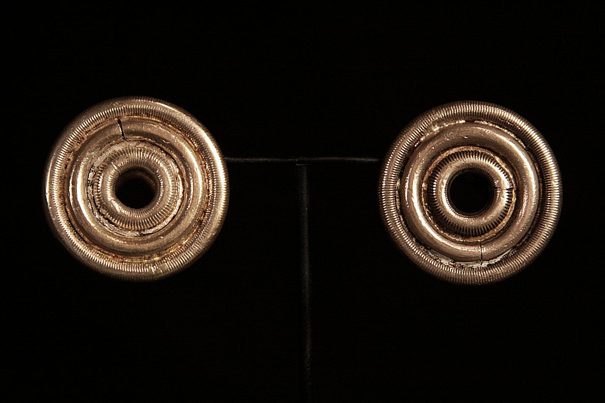 Antique Solid Ear Plug Earrings. Worn by women in Dong Tribe. Zhaoxing, China.jpg