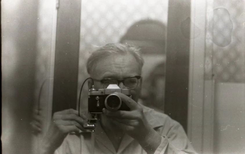 An old image of a man taking a self portrait. Aberdeen and Aberdeenshire Photographer - Leticia Gaidon Bradford Photography - Corporate Photos - Headshots - Personal Brand - Image for Websites - Blog