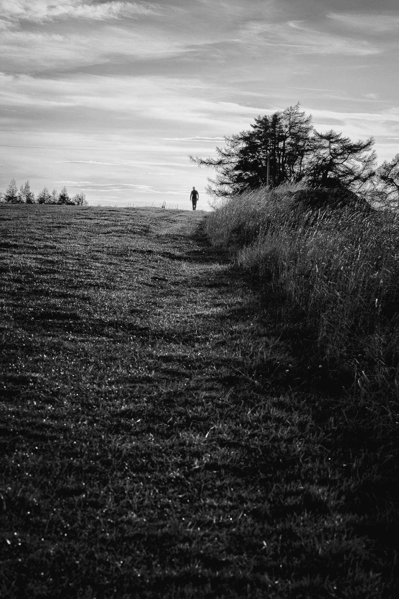 Man walking in the countryside in a cloudy day - Aberdeen and Aberdeenshire photographer -  Leticia Gaidon Bradford - Headshots - Corporative portraits - Brand Photography - Personal branding - Blog