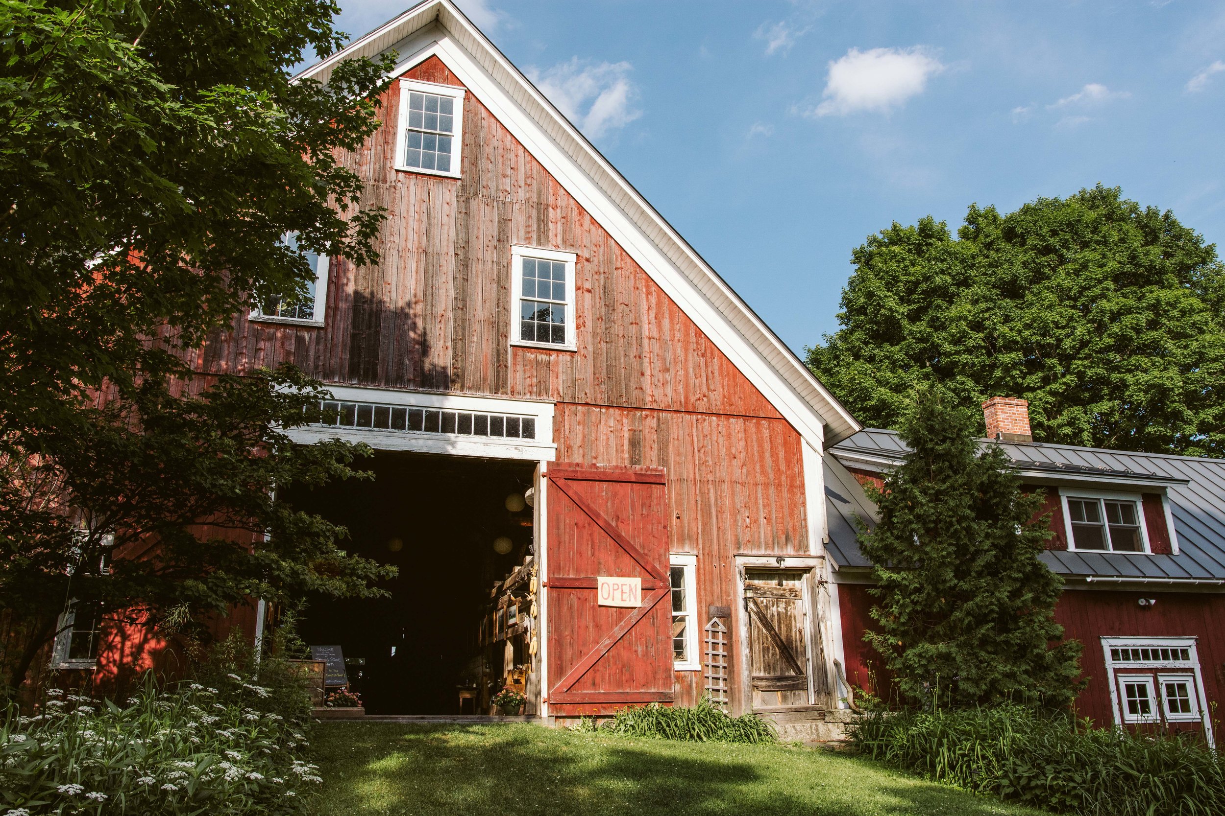 A sunlit barn on a summer day