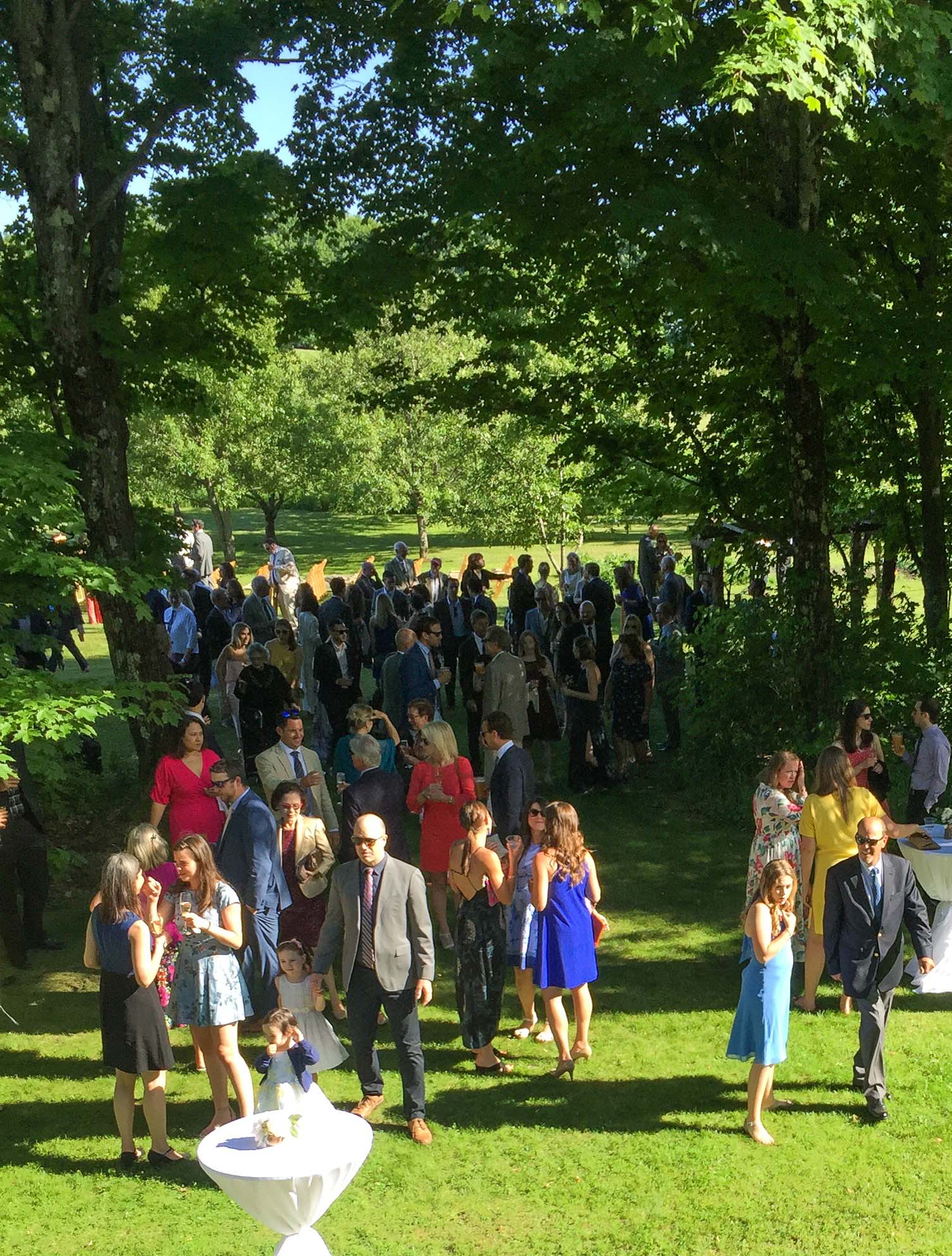 People gathered for cocktails outside the barn