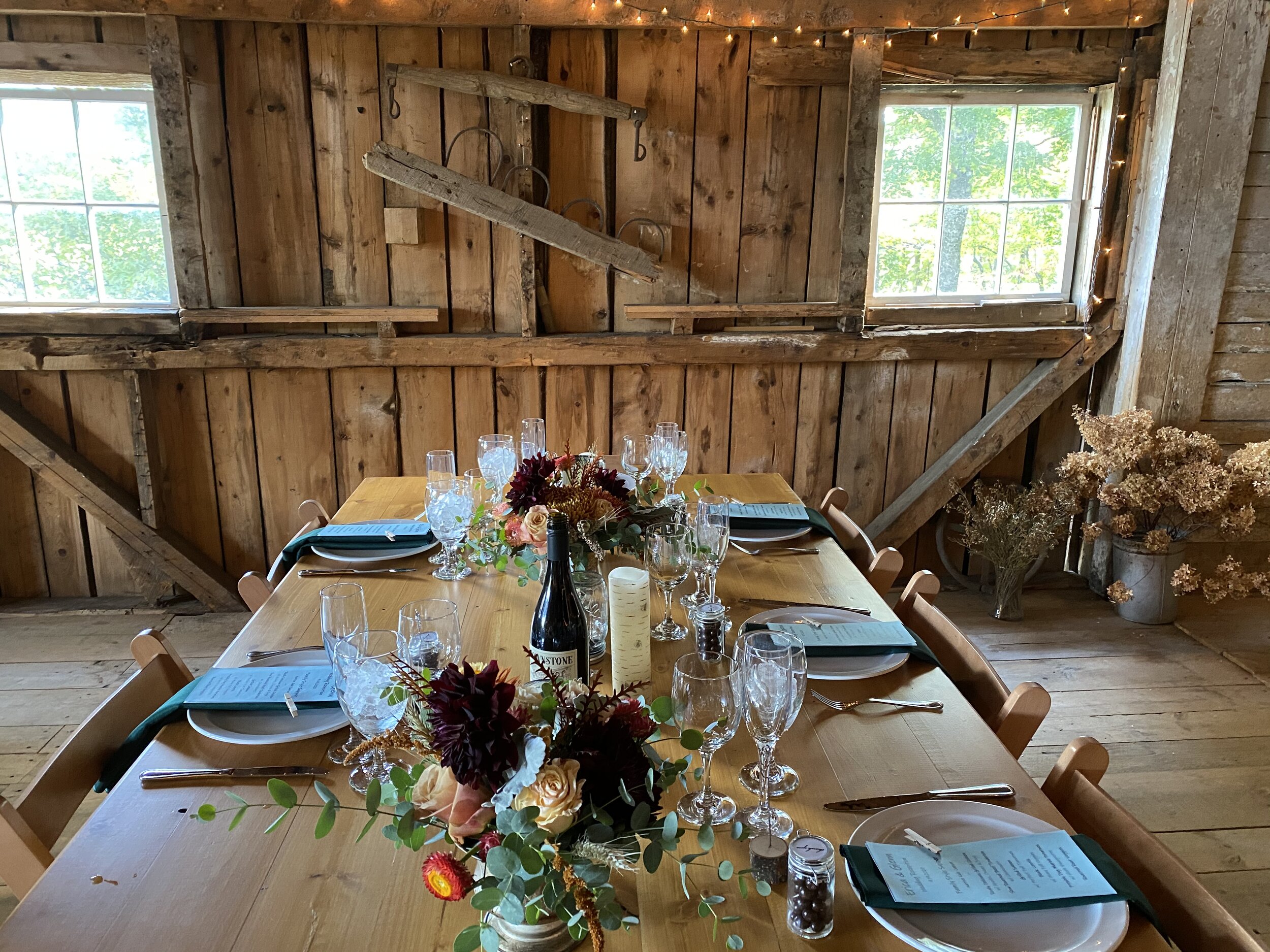 A table set for an intimate dinner in the barn