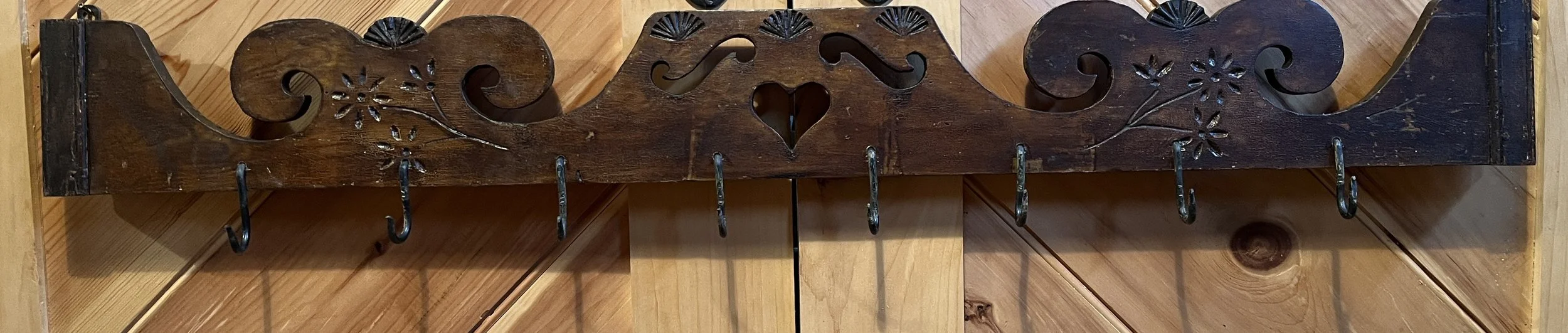  Hanging Rack:  Repurposed cupboard crown with original paint/stain.  50 1/4” w x 6” h (7 3/4” h to bottom of hook).  Early hooks added for hanging/drying herbs, etc.    M-56  $175    