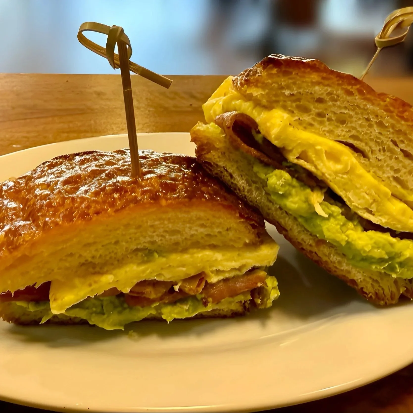 Croissant Breakfast Sandwich with Bacon, Egg, and Avocado