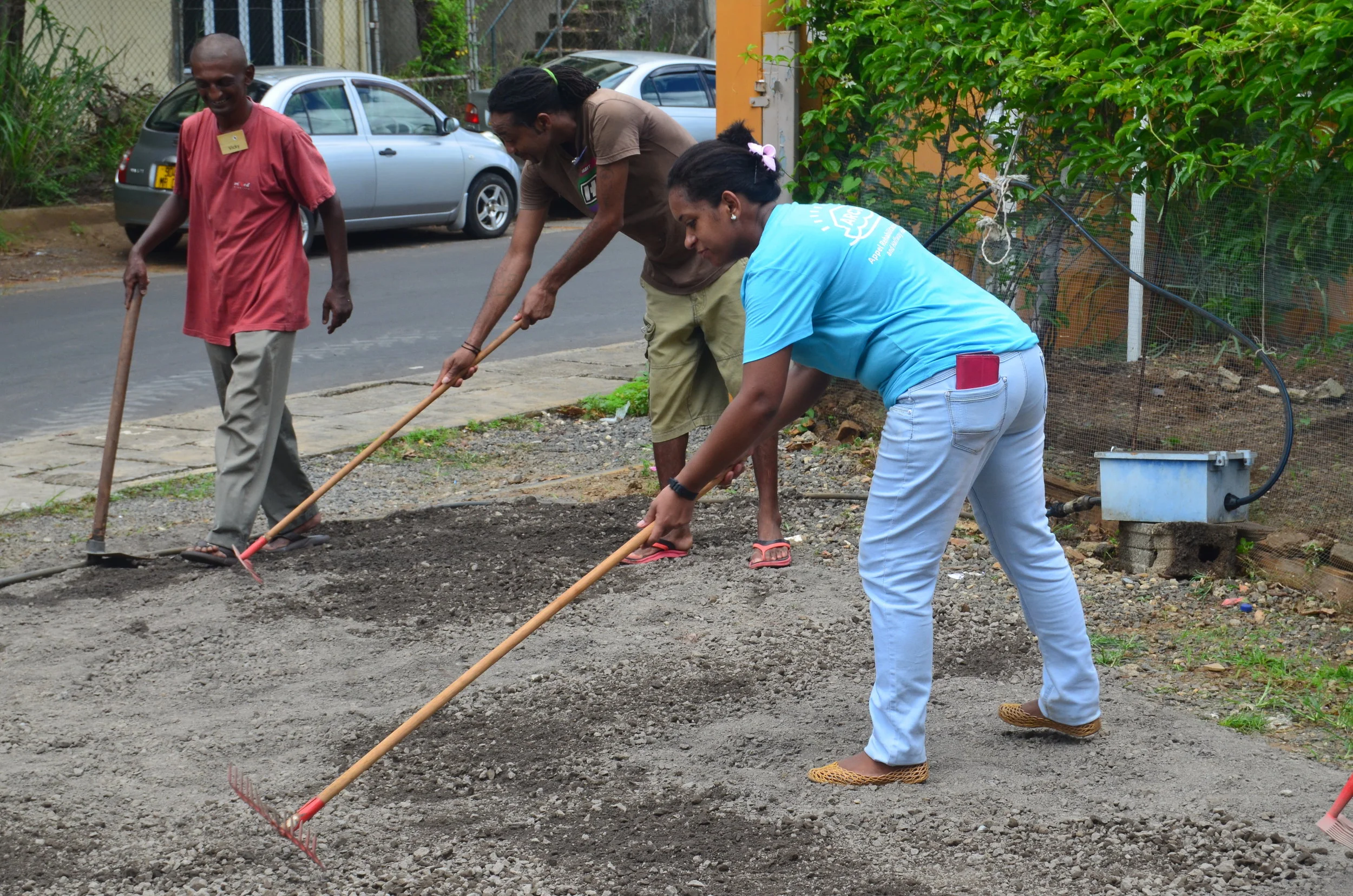 Staff and beneficiariesTeam work.JPG