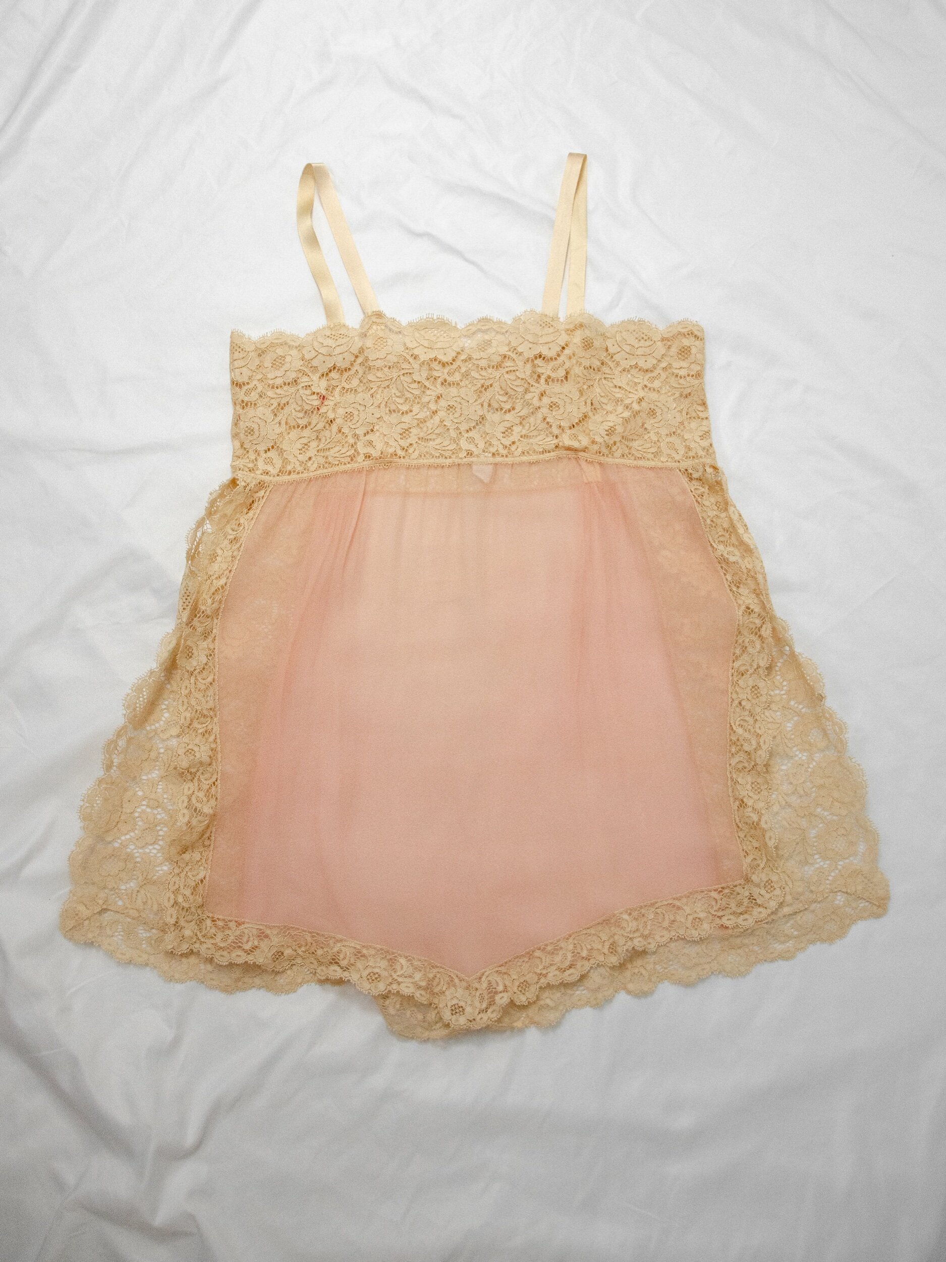 Back view of the 1920s dusty rose silk teddy laid flat, showing the lace back panel and straps.