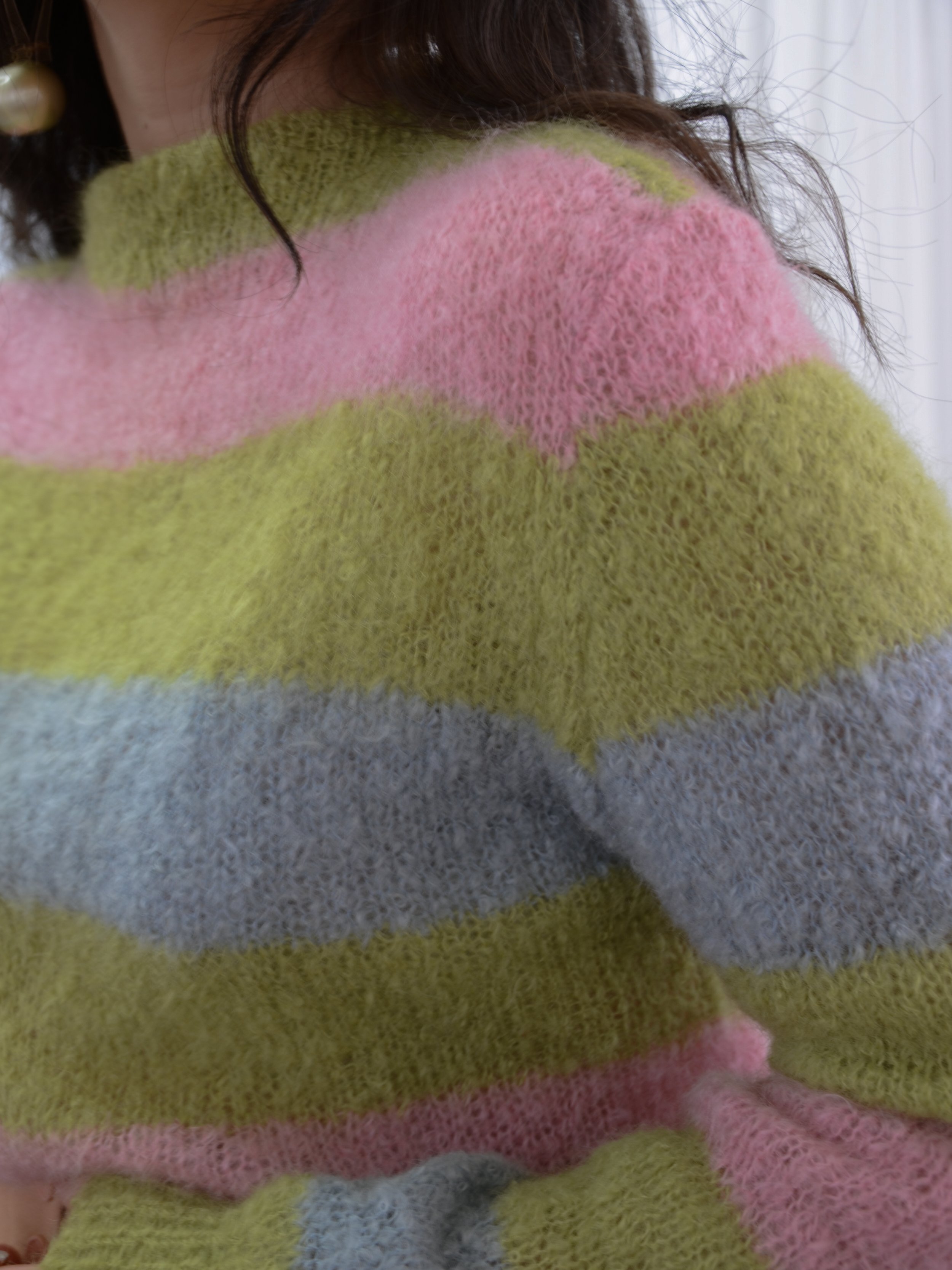 Close-up of the 1960s color block jumper's mock neck and fuzzy striped knit.