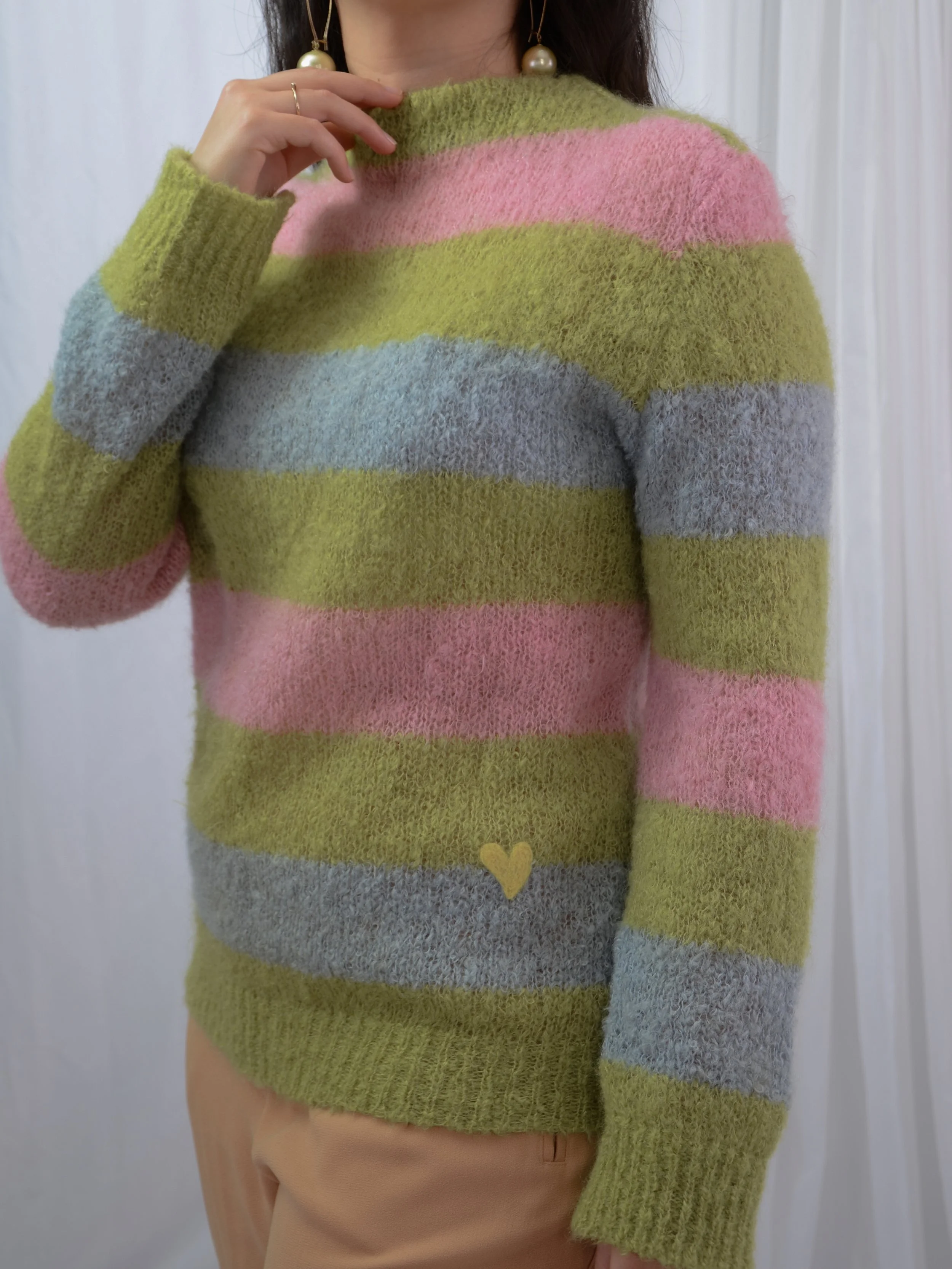1960s fuzzy lime, pink and blue striped jumper worn untucked on a model, showing the yellow heart.