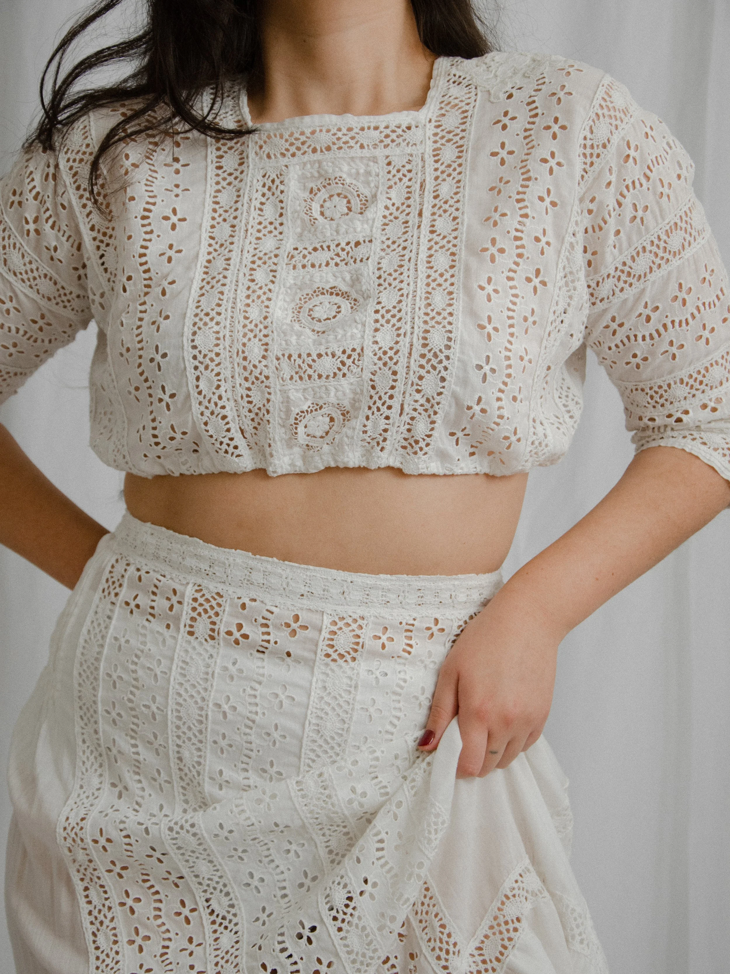 Close-up of the Edwardian eyelet set's cropped top with crochet lace panels and half sleeves.