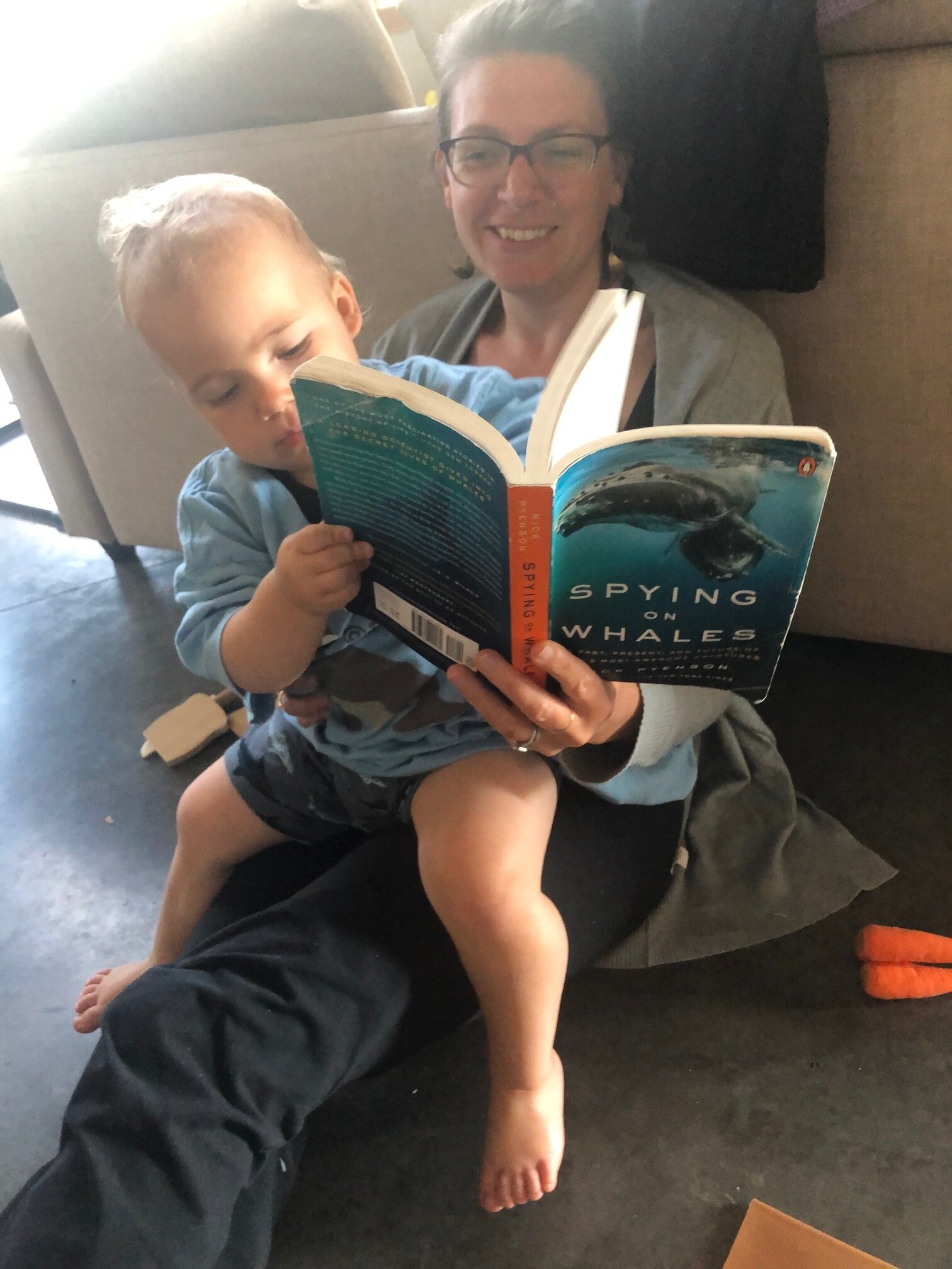 Dr. Robertson reading to her son about whales