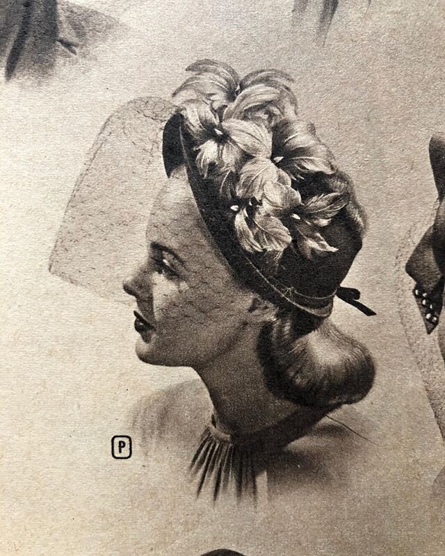 Open crown peaked bonnet of better new wool felt. Provocative trim of feather flowers. Mesh veil. Available in all black; black with beauty red feathers; brown with lime green; brown with beige; navy with ice blue. $5.00. 1946-1947 Fall and Winter Mo