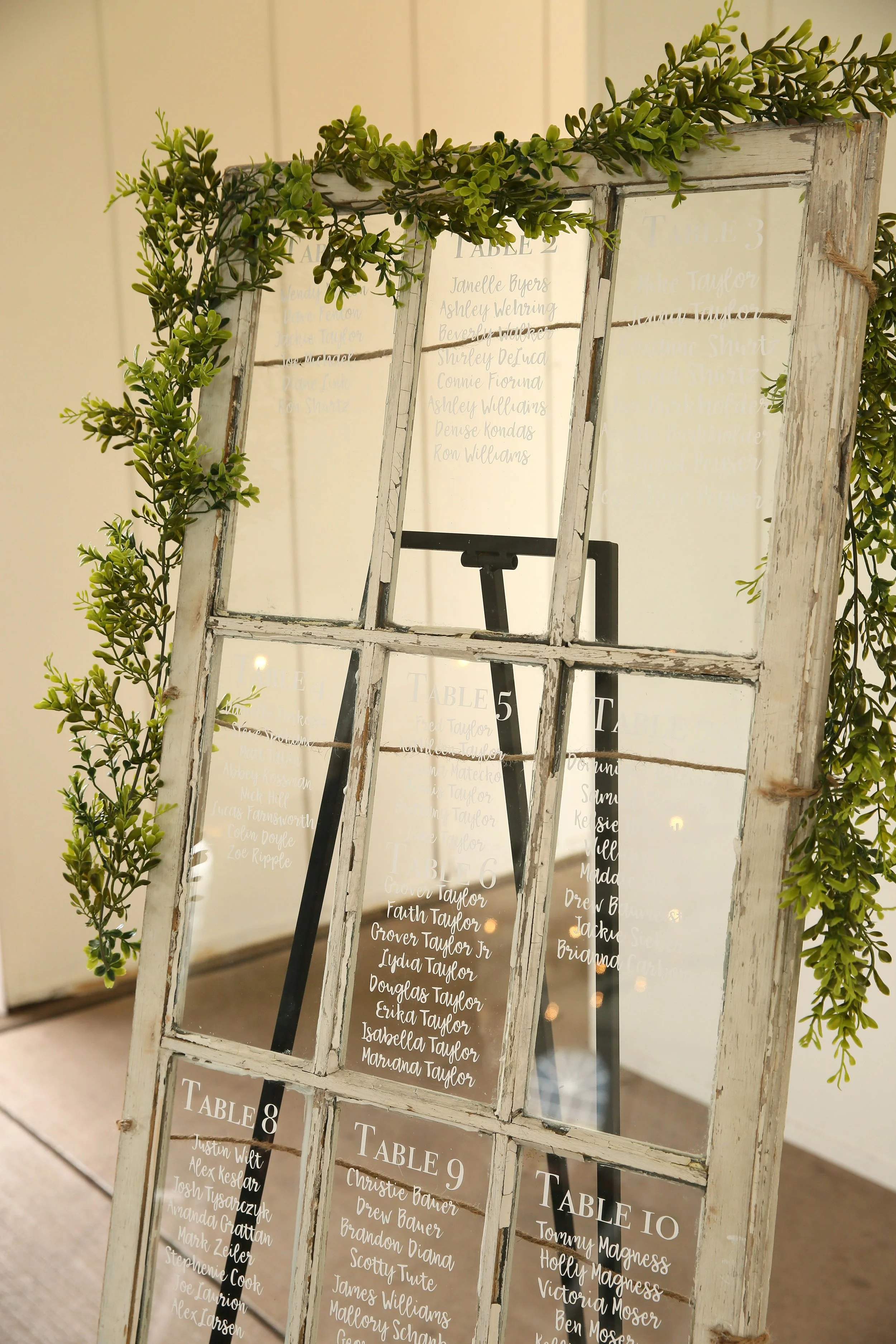 rustic wedding venue glass seating chart