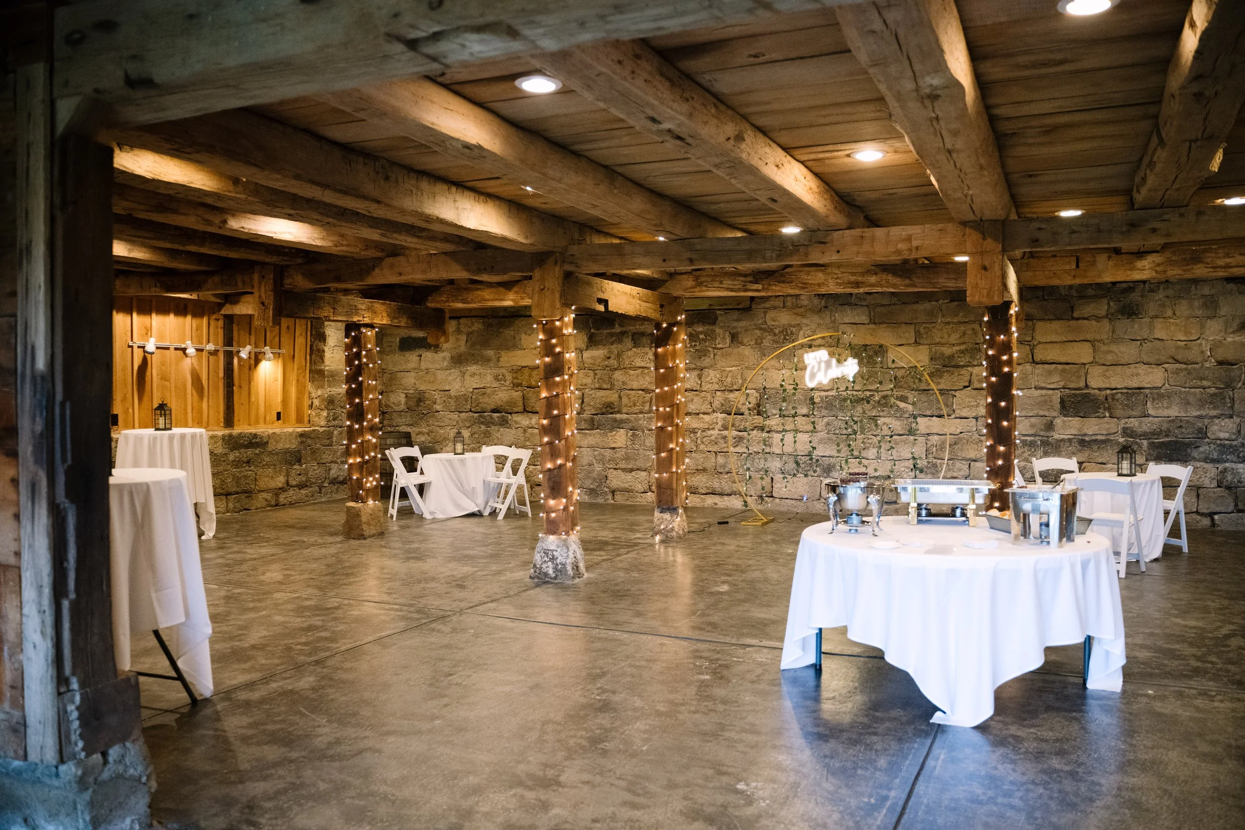 Lower level Armstrong Farms Fieldstone cocktail hour barn wedding venue