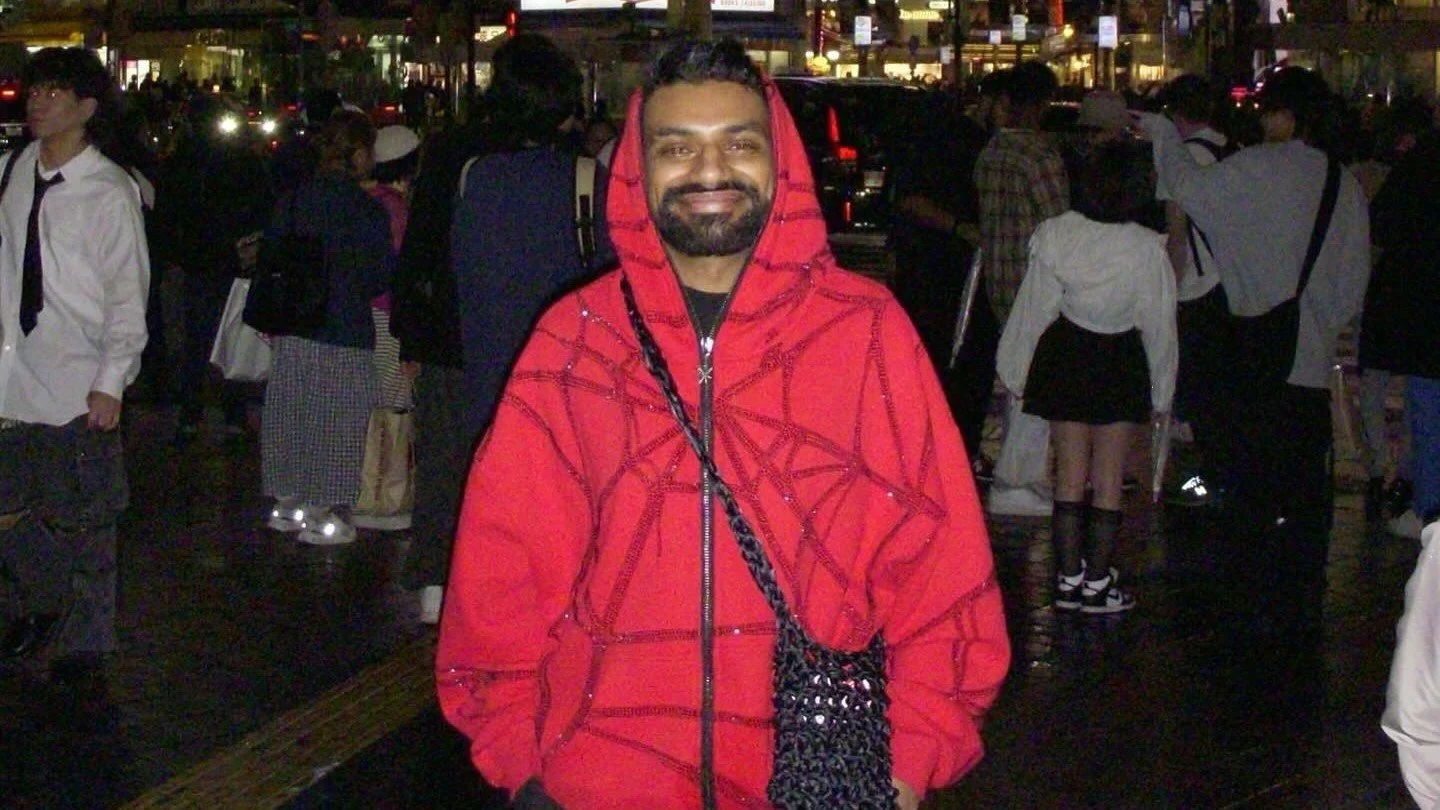 Zaleel in pink spider web pattern puffa jacket.