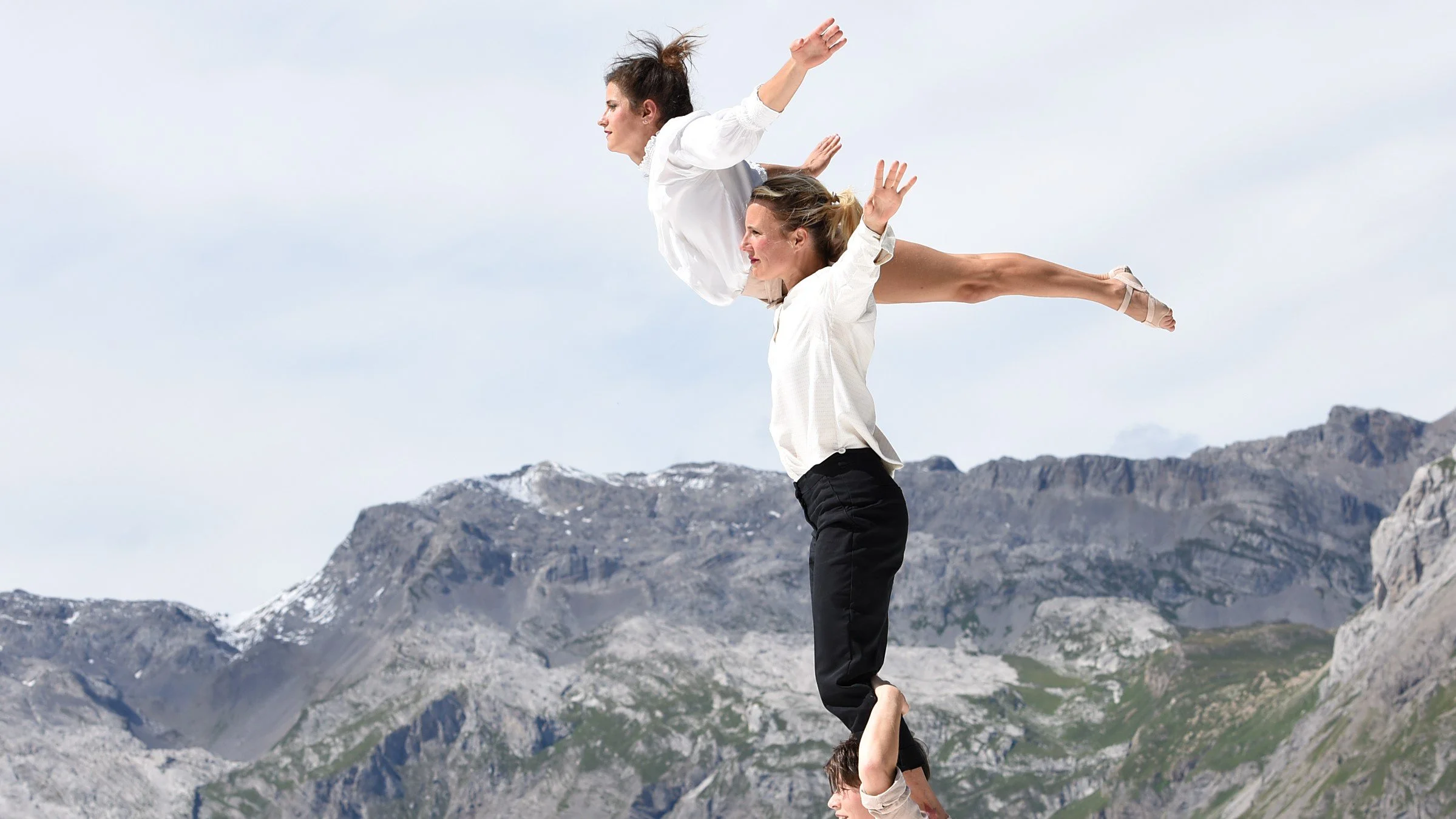 The three acrobats from La Triochka rehearsing Top Down in the Alps.