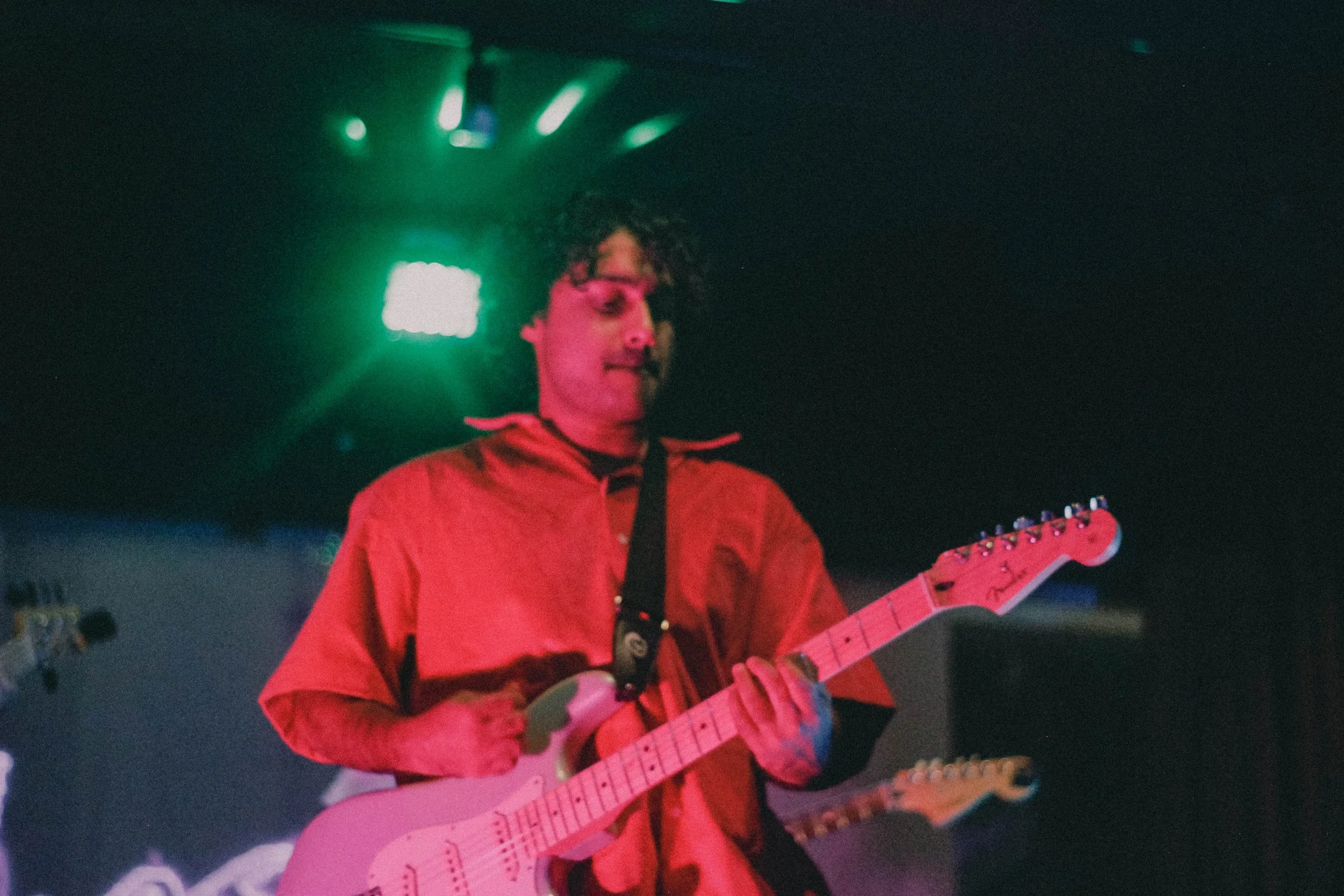 Misbah playing live with guitar.