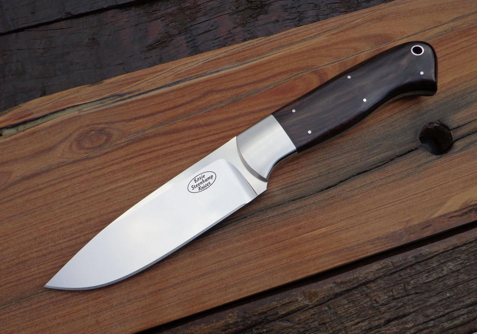 Shikar Hunter Blade: Böhler N690 Stainless Steel. Coachwork: 304 Stainless Steel. Handle slabs: African Blackwood.