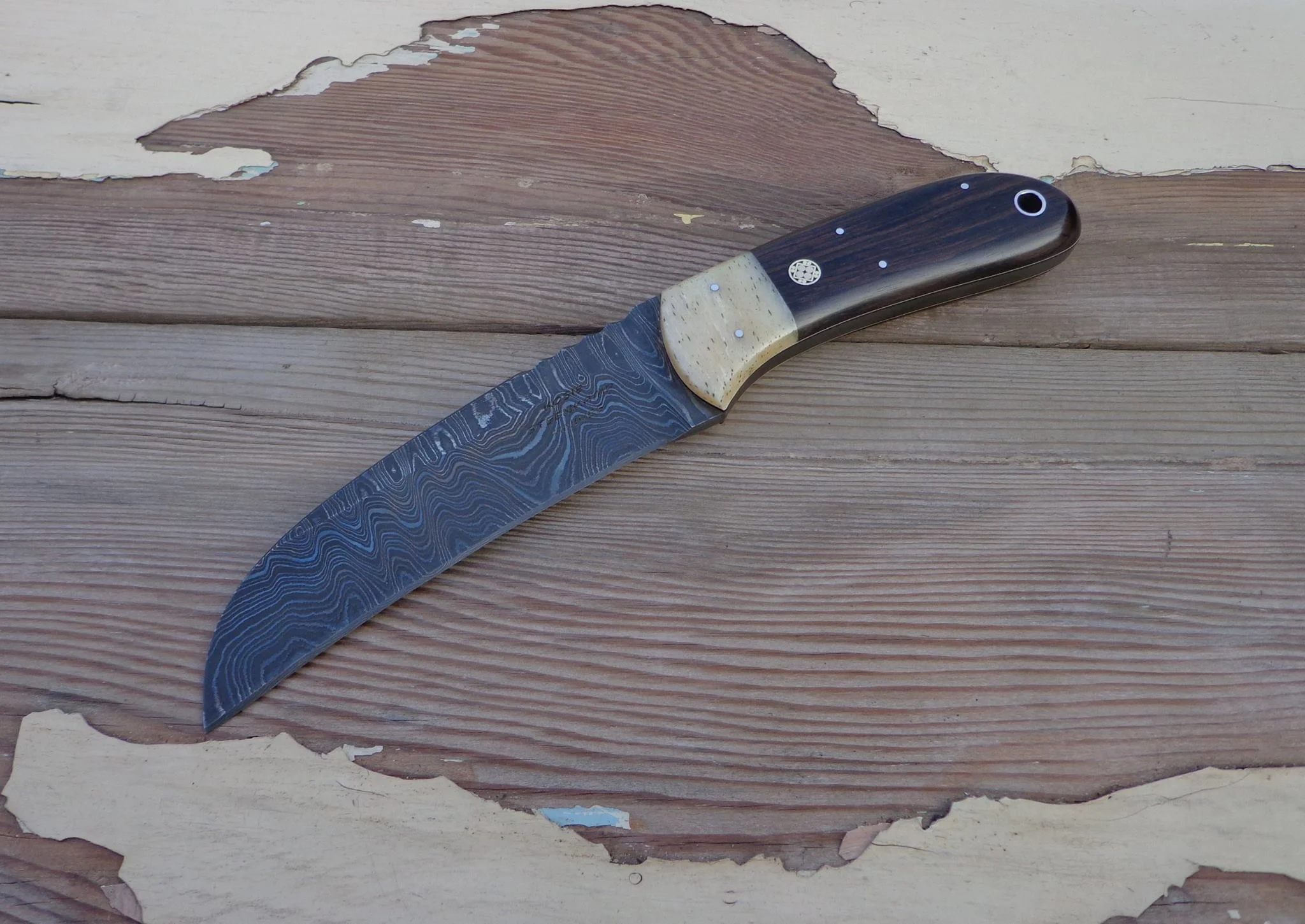 Biltong Knife: Blade: Alabama Damascus, Coachwork: Giraffe Bone, Handle: African Blackwood with white liners.