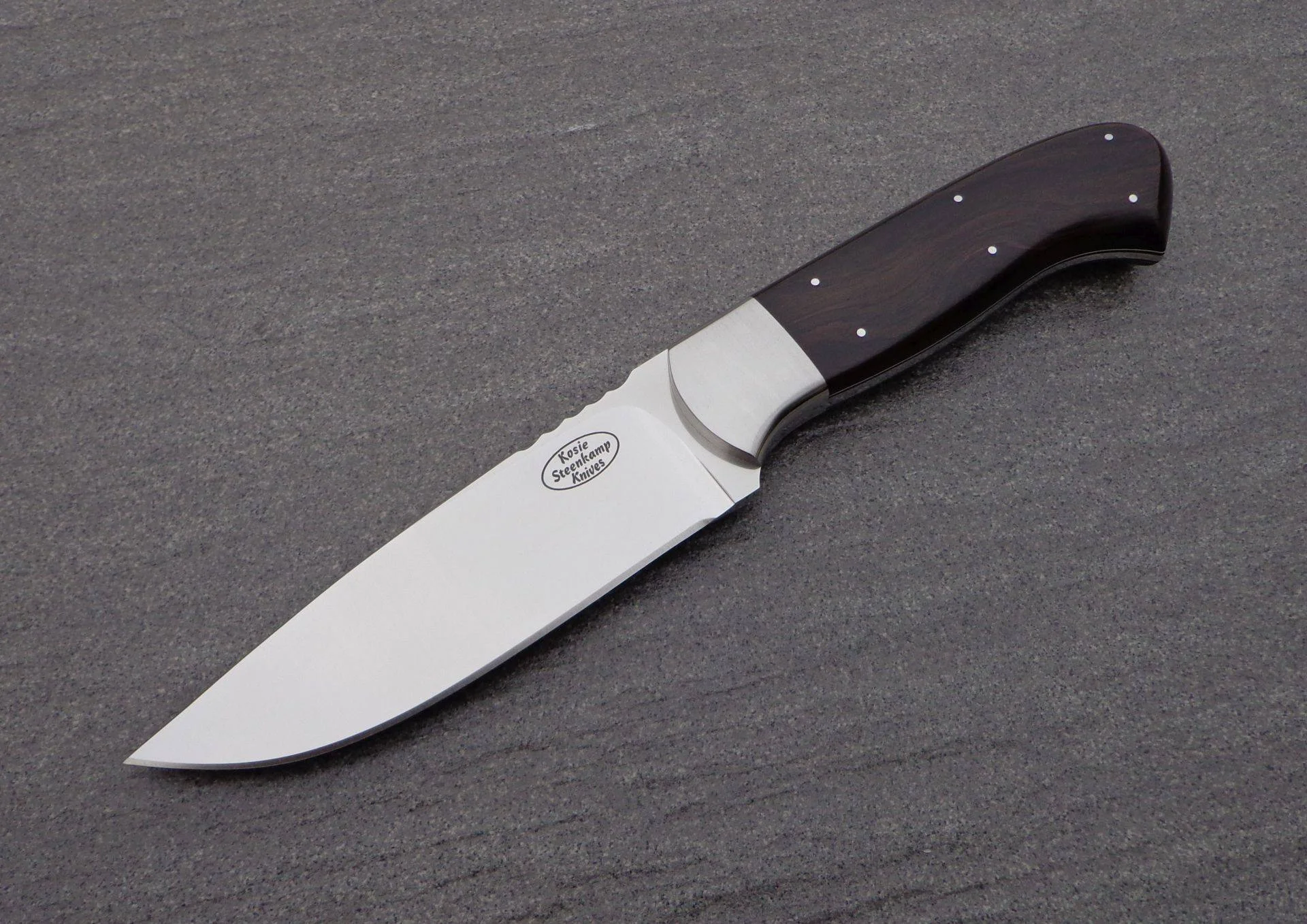 Blade: Böhler N690 Stainless Steel. Coachwork: 304 Stainless Steel. Handle slabs: African Blackwood.