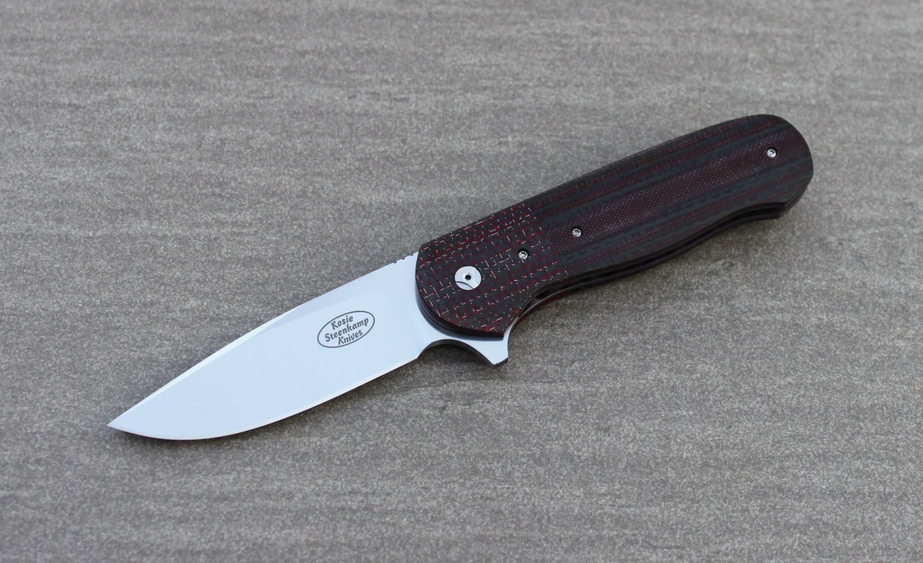 Knife: Vantage Flipper Liner Lock - IKBS. Böhler N690 Stainless Steel blade. Titanium liners with red LSCF + red and black G10 handle scales. Titanium belt clip.
