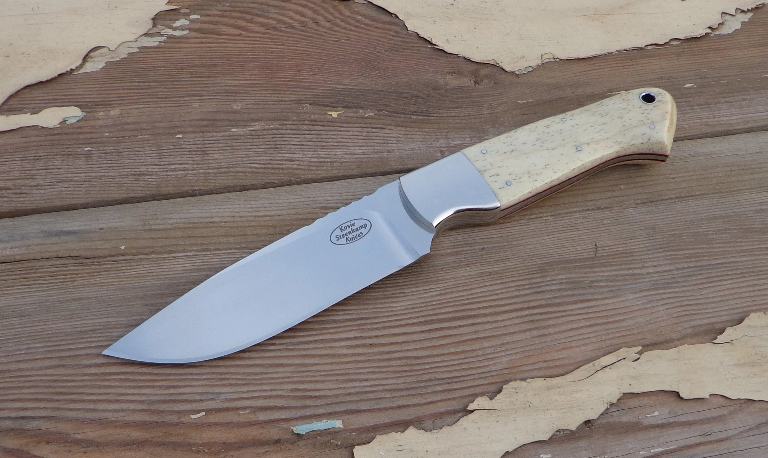 Cass Hunter. Böhler N690 Stainless Steel blade. 304 Stainless Steel bolsters. Giraffe Bone handle slabs.