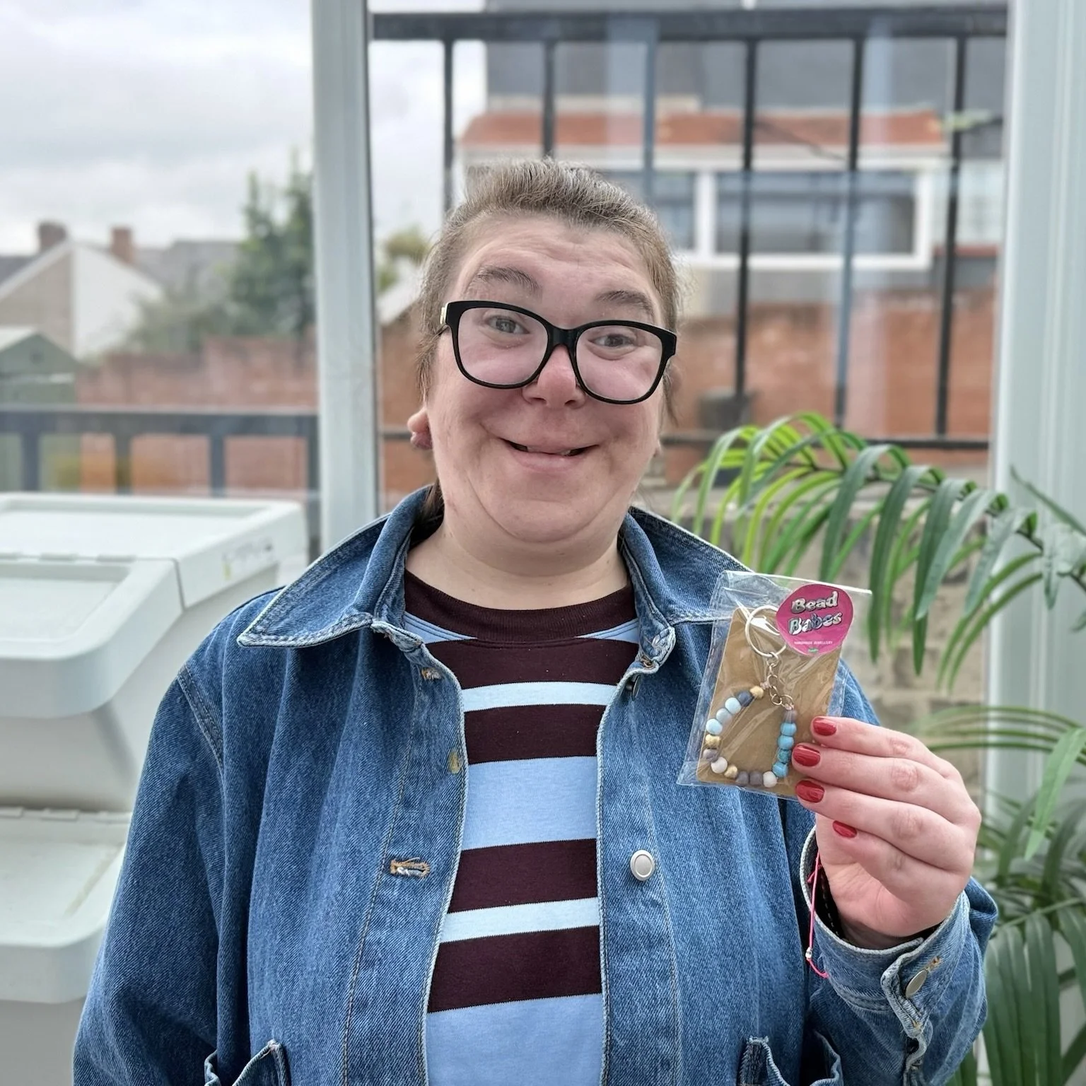Zita Showing Off The Merch.jpeg