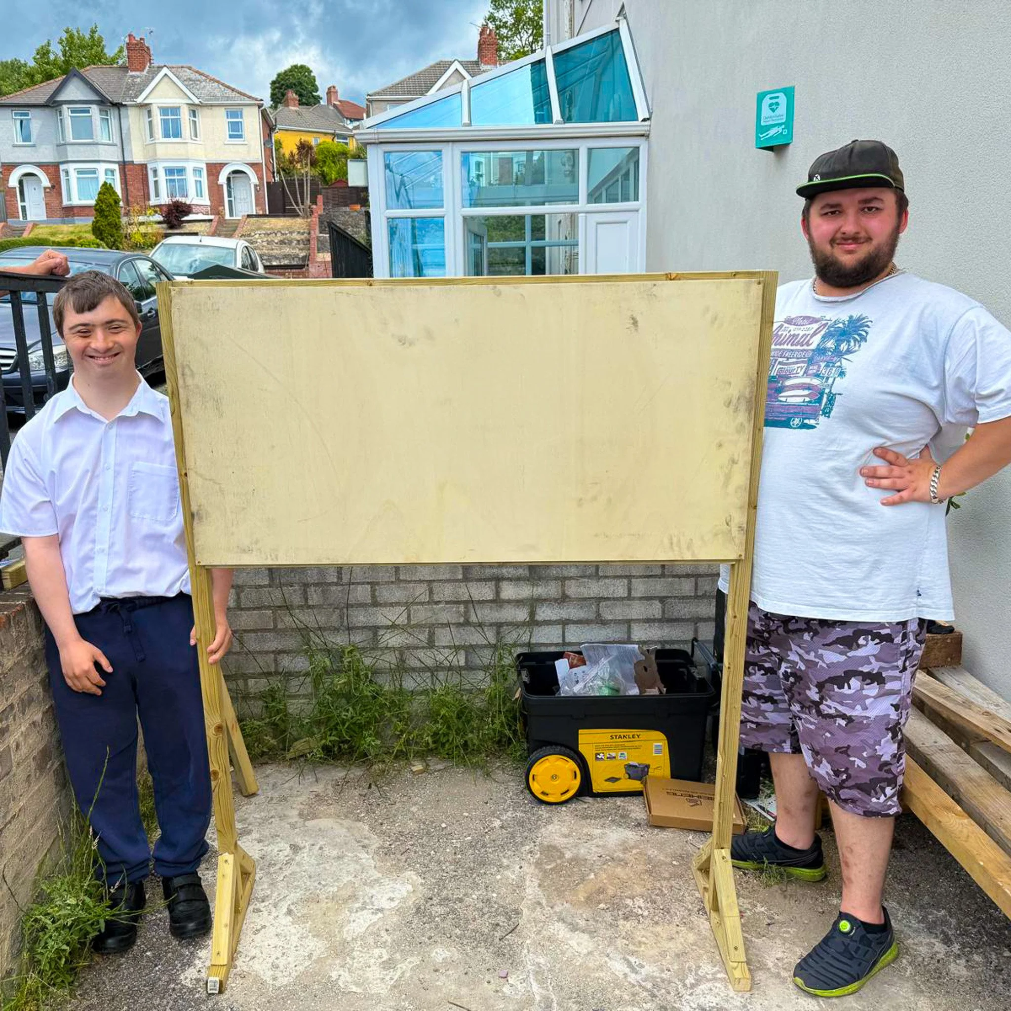 Andrew and Kye with the game board.jpg