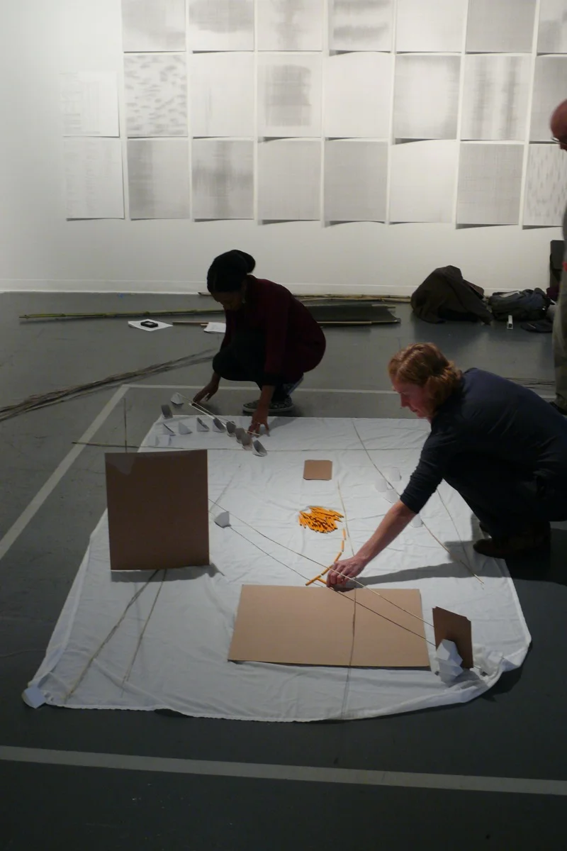  Collaborating to form a drawing on the floor with found &amp; assembled materials from  3 Strategies for Surprise , Creative Alliance, 2013 
