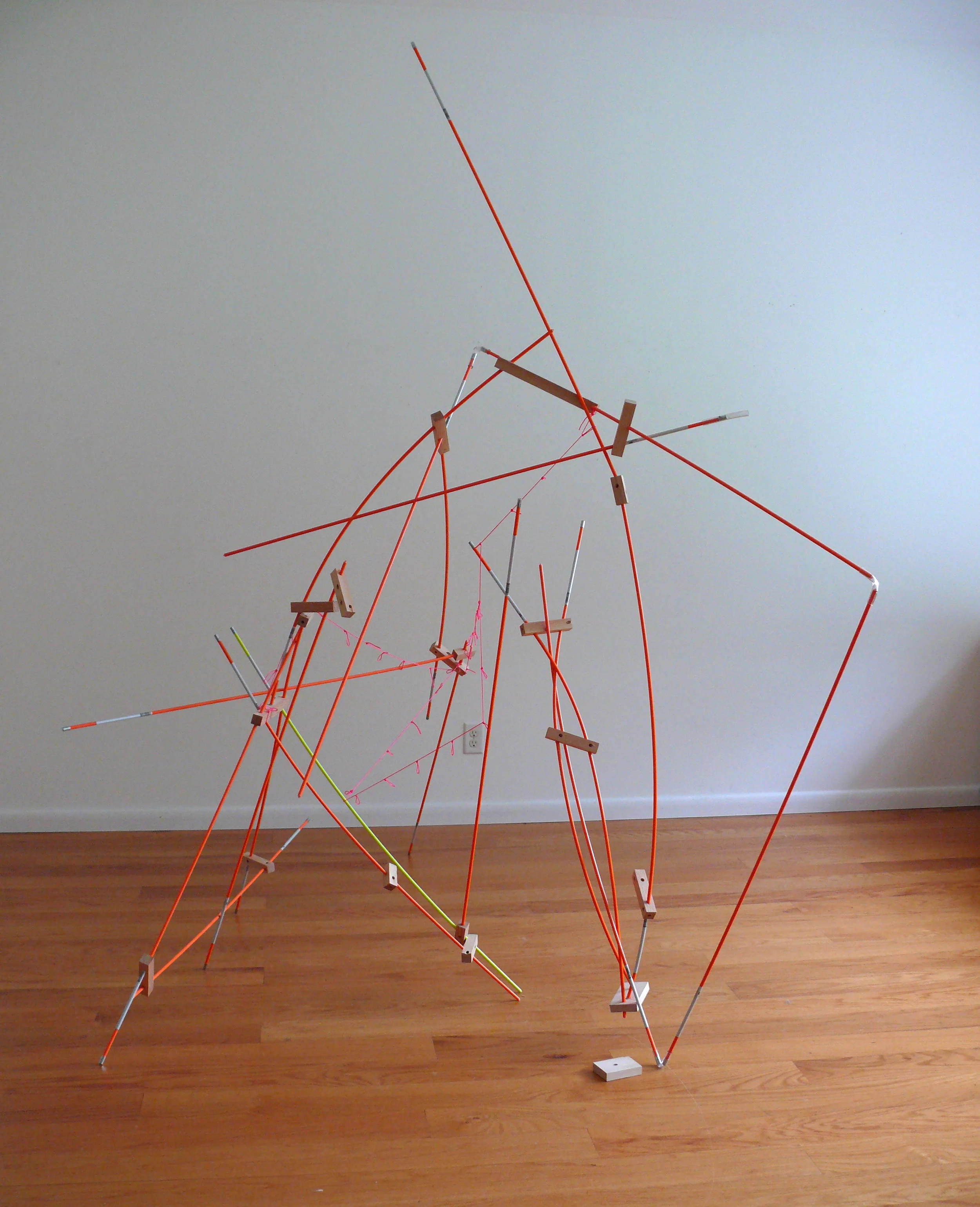   Untitled , 2018, string, wood blocks, road markers 